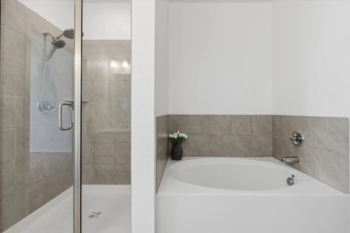 Spacious primary bath with a relaxing garden tub.