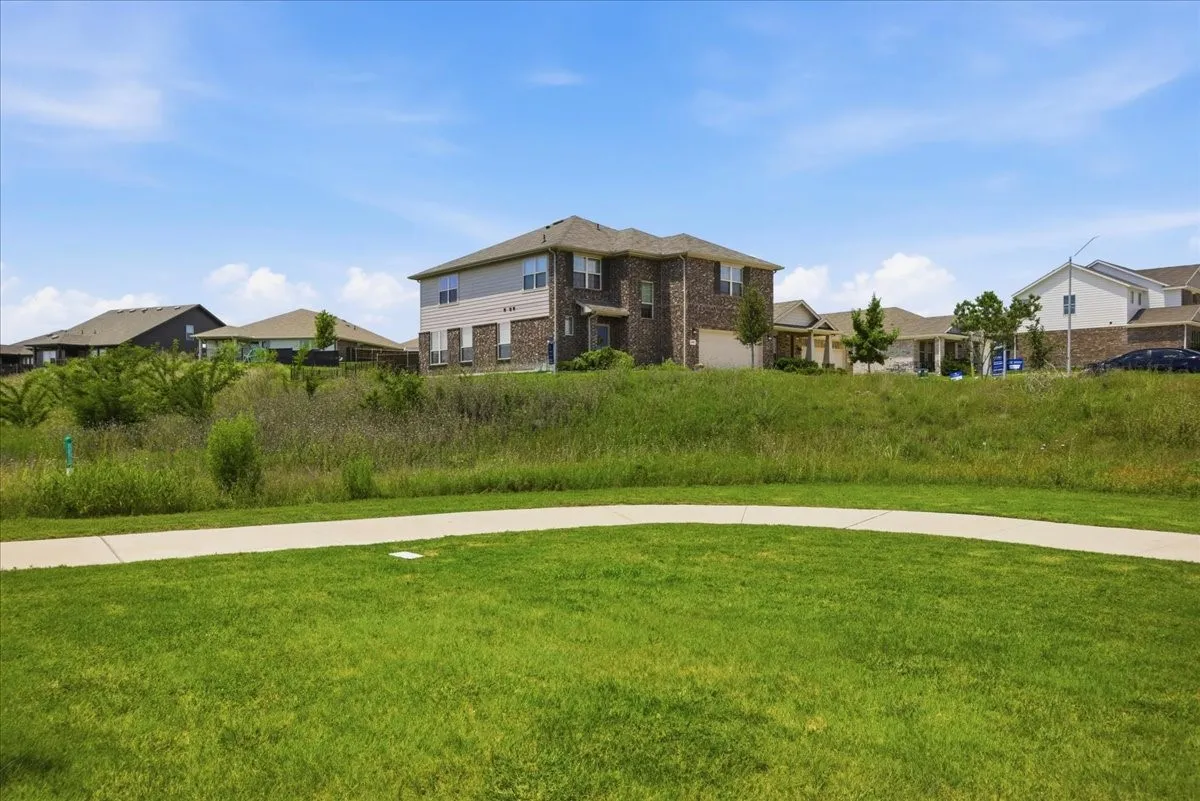 A private, elevated corner lot offering exceptional, wide-reaching views.