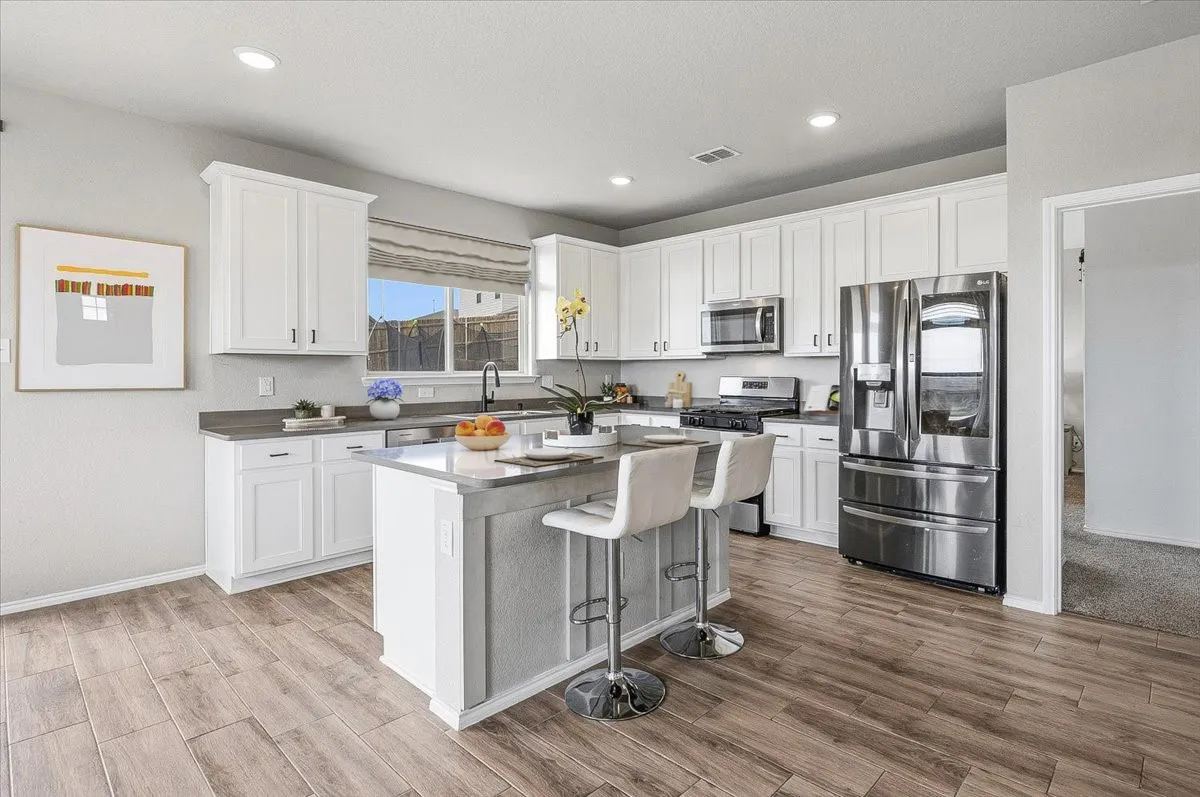 A crisp, modern kitchen brightened by natural light.