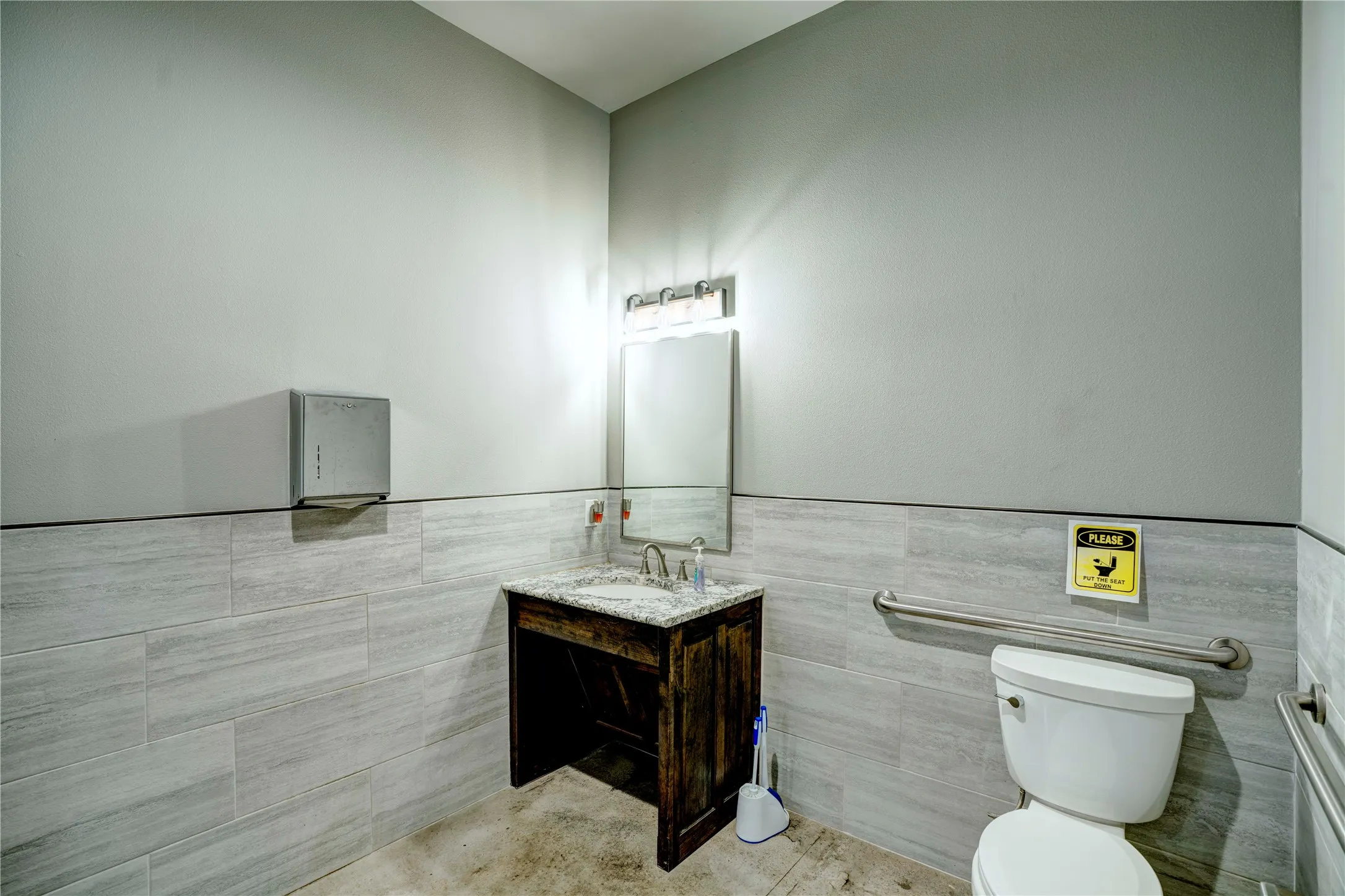 Vanity with granite countertop and undermount sink