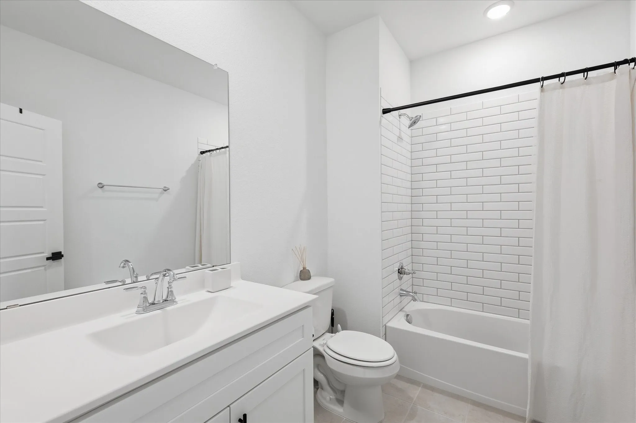 Bathroom that is bright and offers plenty of storage in the linen cabinets.