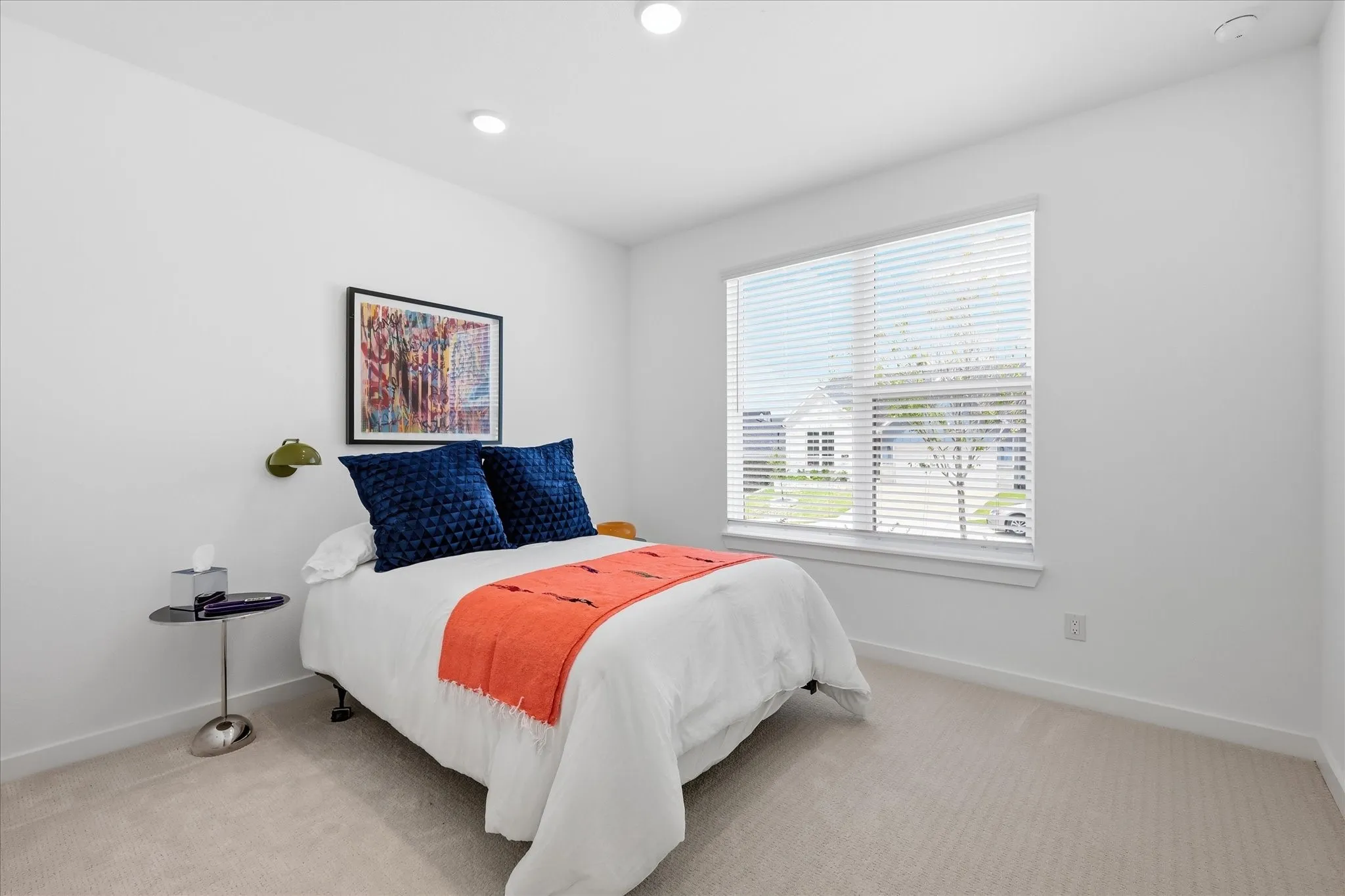 Additional bedroom on first floor of home, perfect for guests with a bathroom just across the hall.