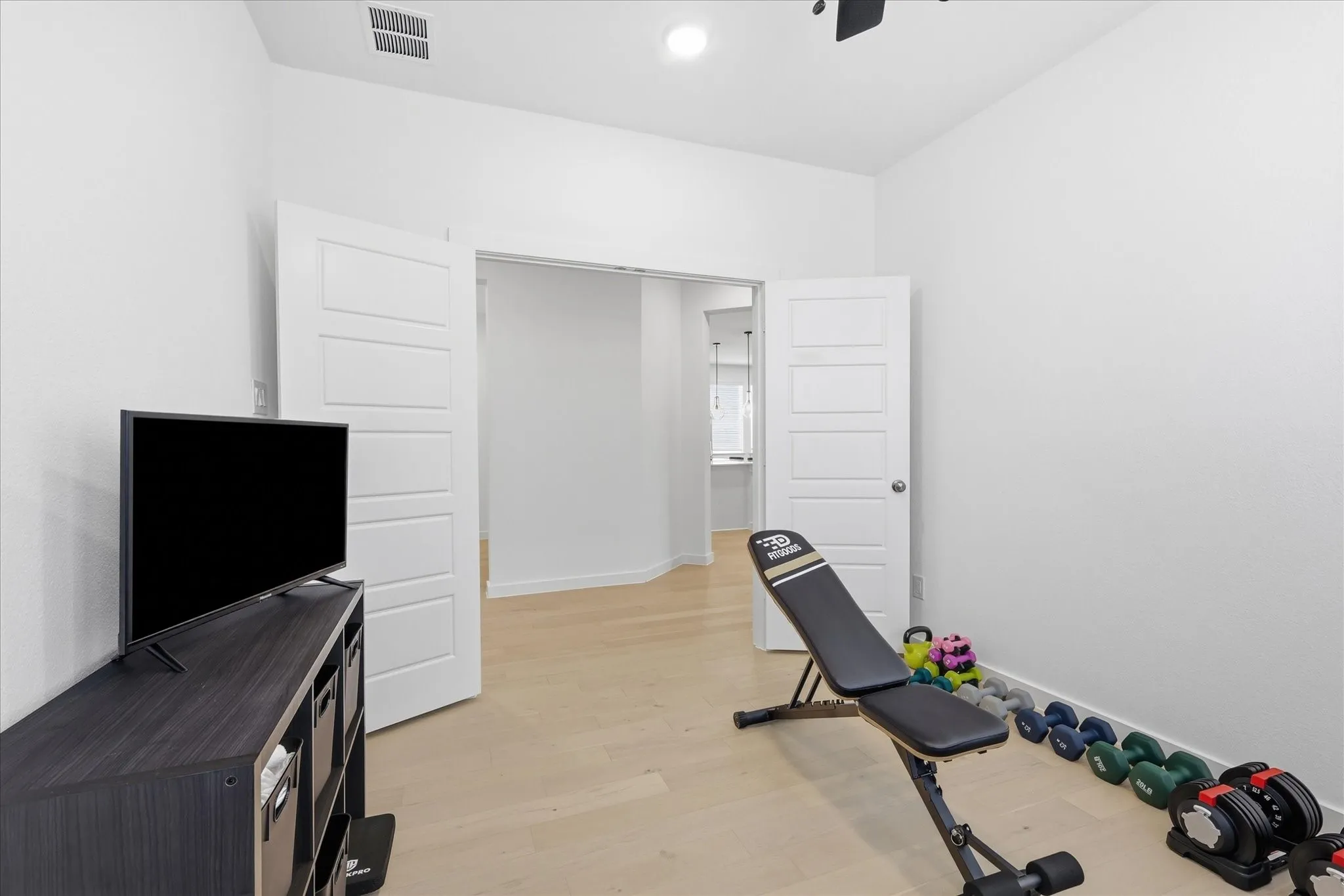 Additional room that could be used as dedicated office space but is currently being utilized at workout room.