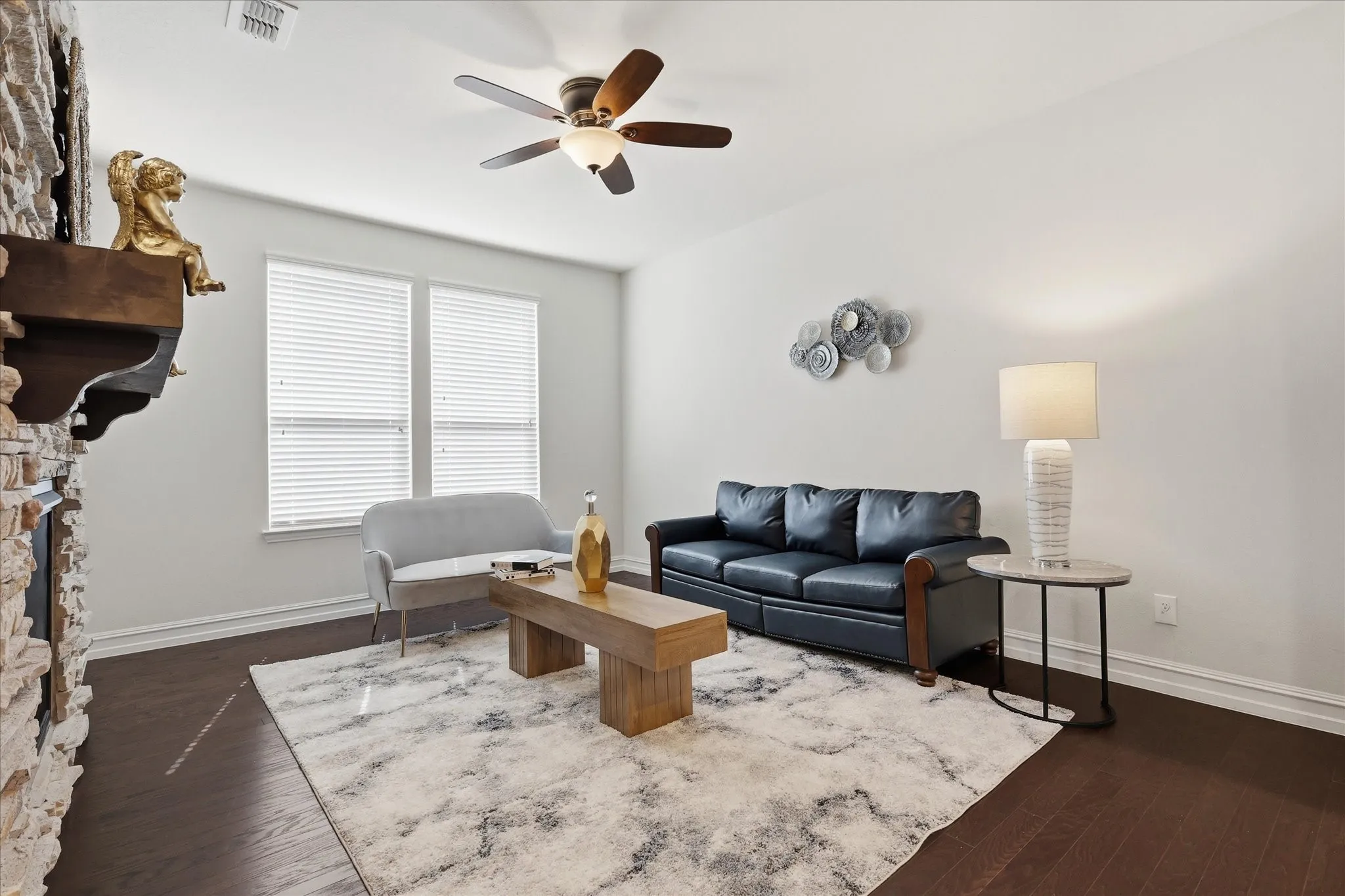 Living area featuring dark wood-finish flooring and light-toned walls