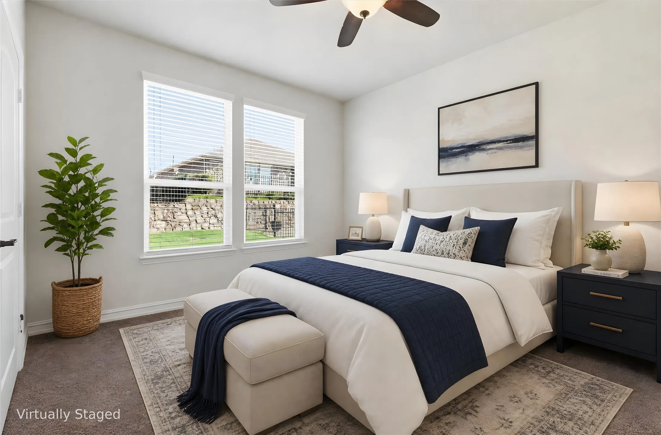 Carpeted room featuring dual windows with blinds, a ceiling fan, and a neutral wall color