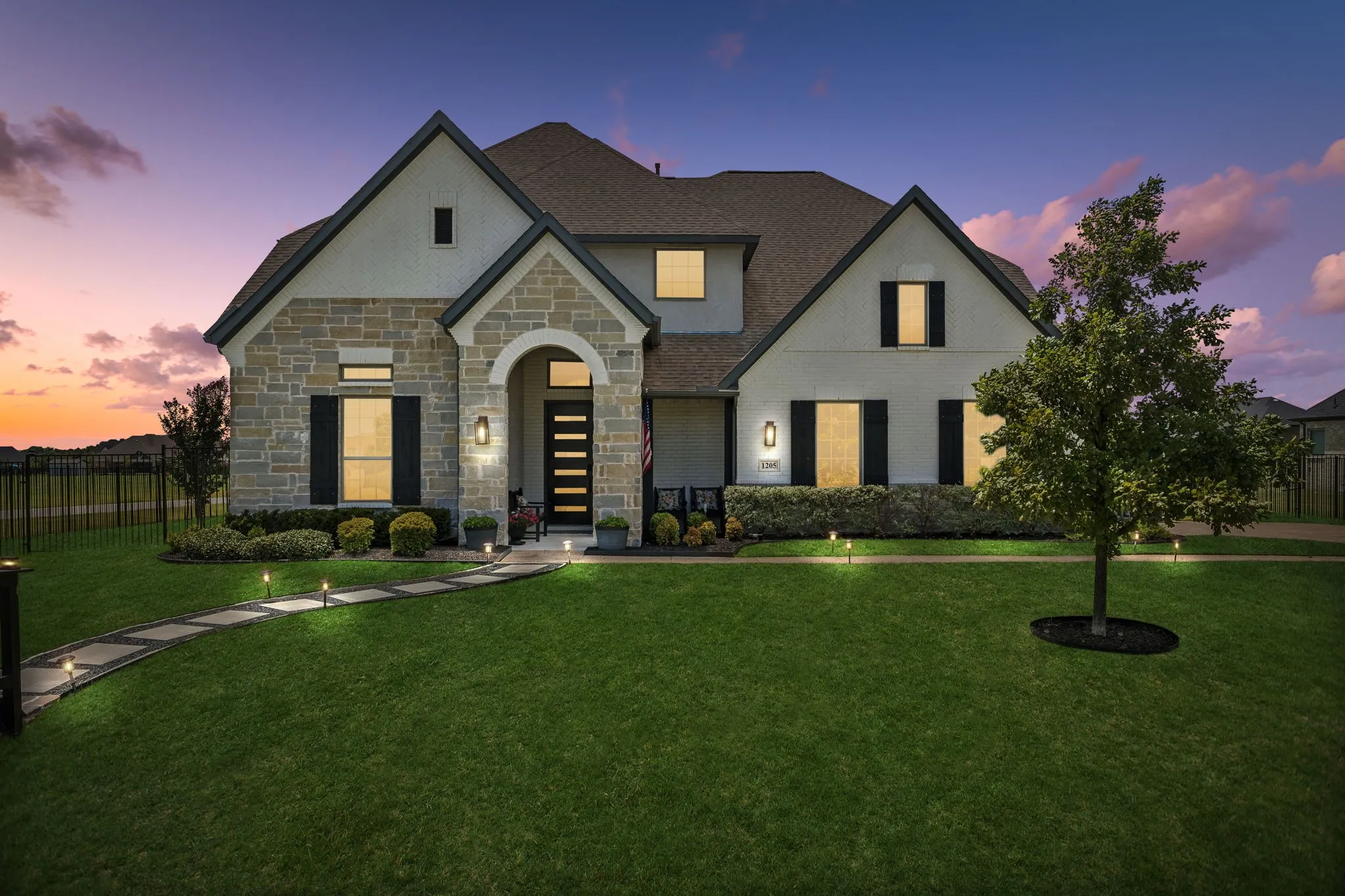 Beautifully designed custom home offering six garage spaces, a fully equipped private guest apartment, and exceptional versatility for entertaining, multigenerational living, or hobbyists seeking unmatched space.