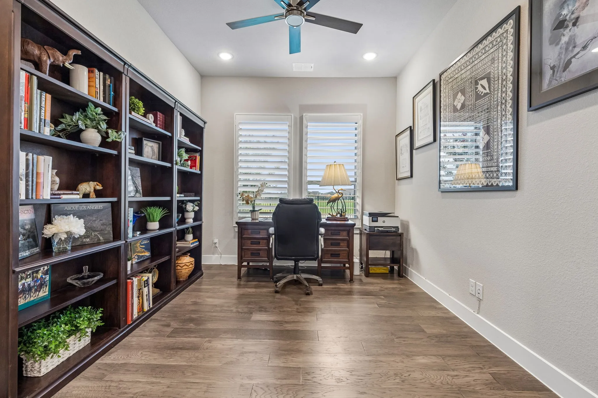 Beautiful double doors lead to the private office with plantation shutters.