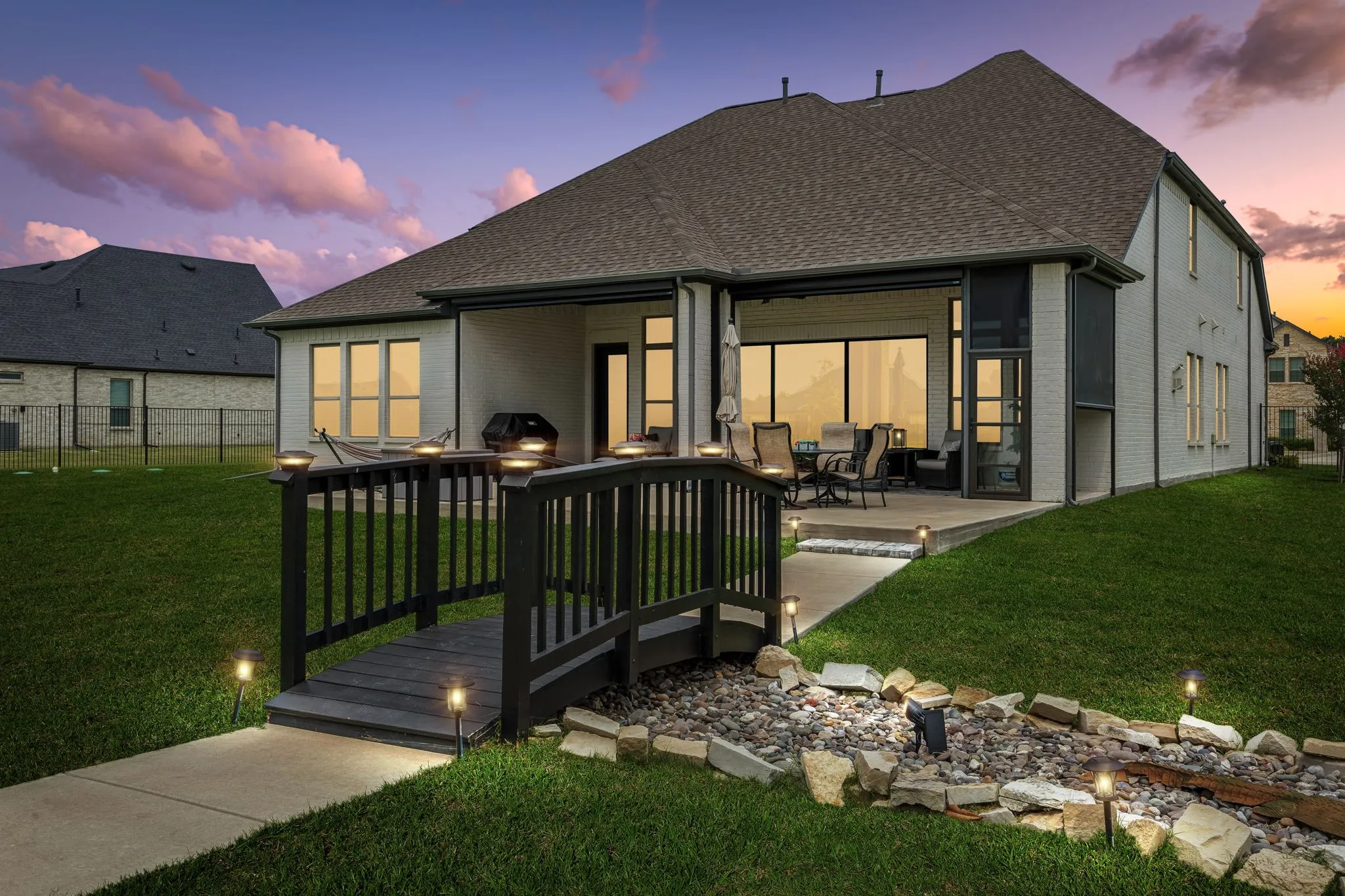 Beautifully designed custom home offering six garage spaces, a fully equipped private guest apartment, and exceptional versatility for entertaining, multigenerational living, or hobbyists seeking unmatched space