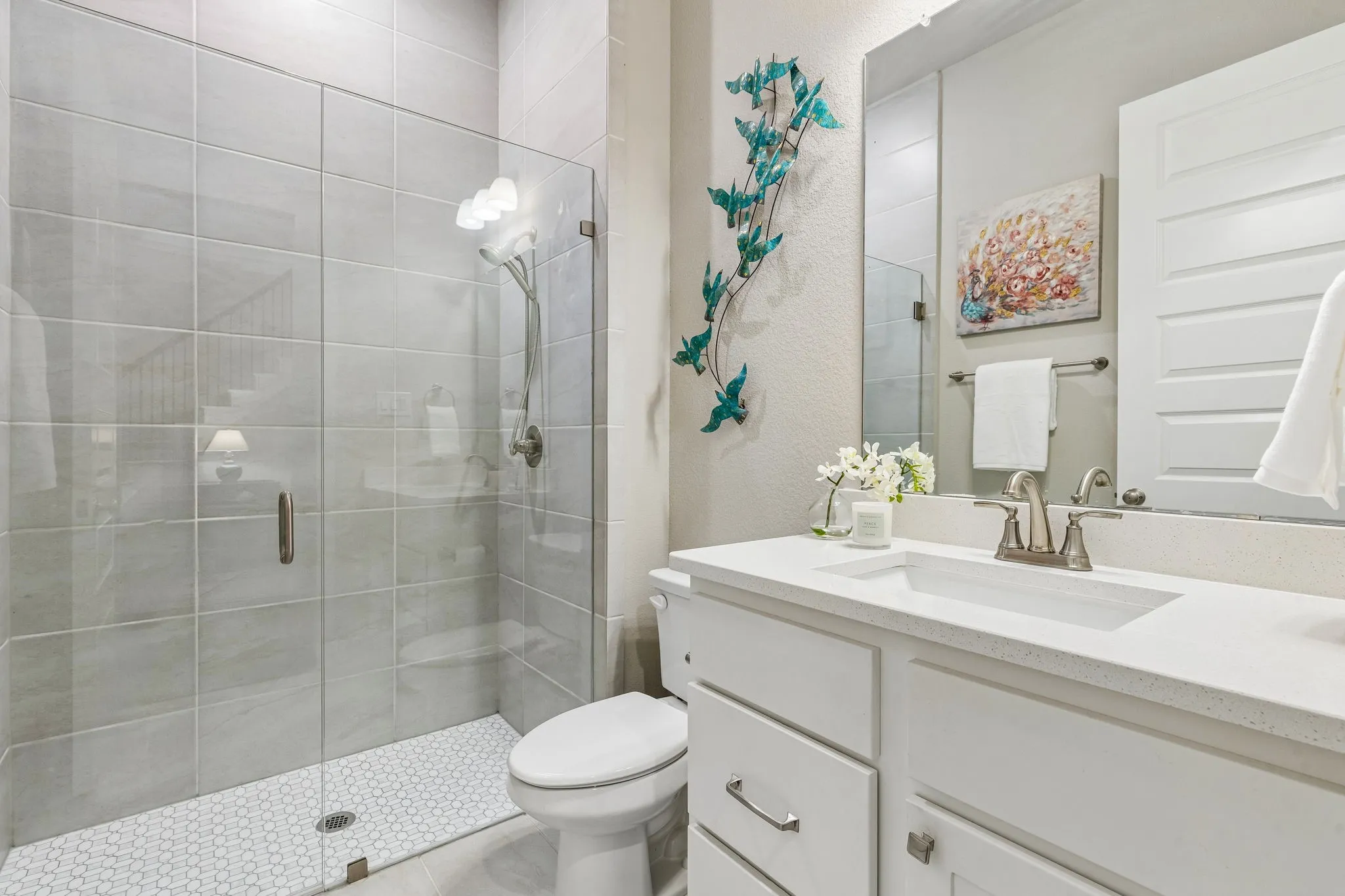 First floor full bath with walk-in shower provides easy access to the first-floor guest suite.