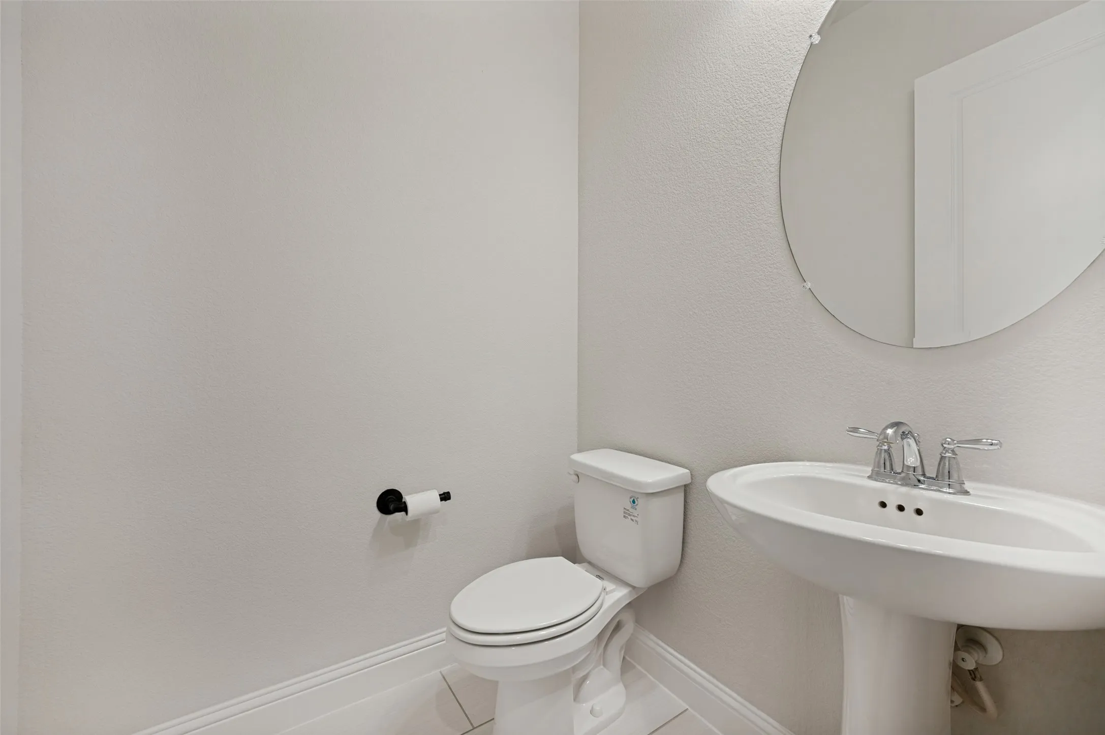 Convenient guest powder bath located off the main living area.