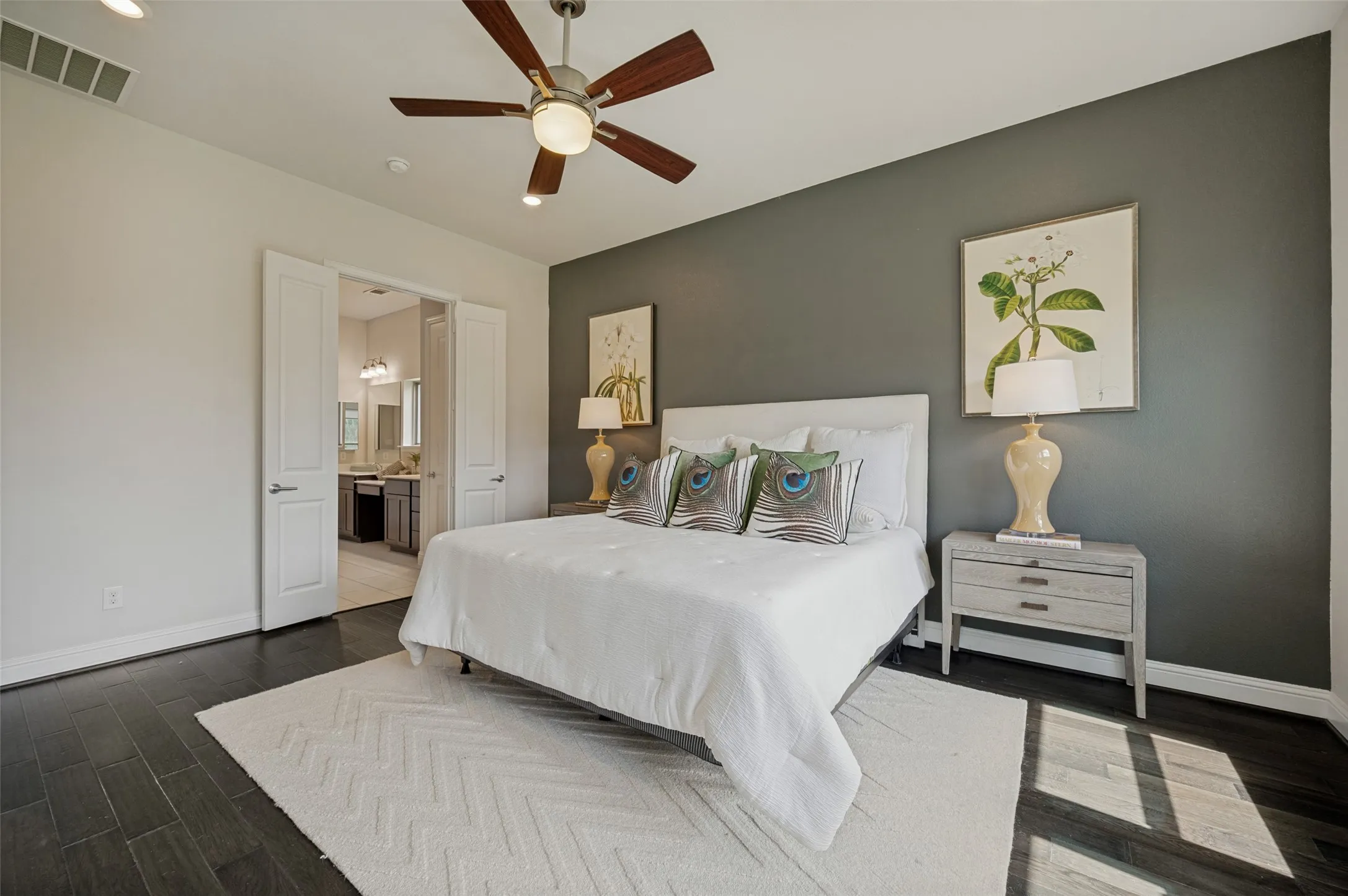 Spacious primary bedroom retreat with abundant natural light and direct access to the luxurious ensuite bath.