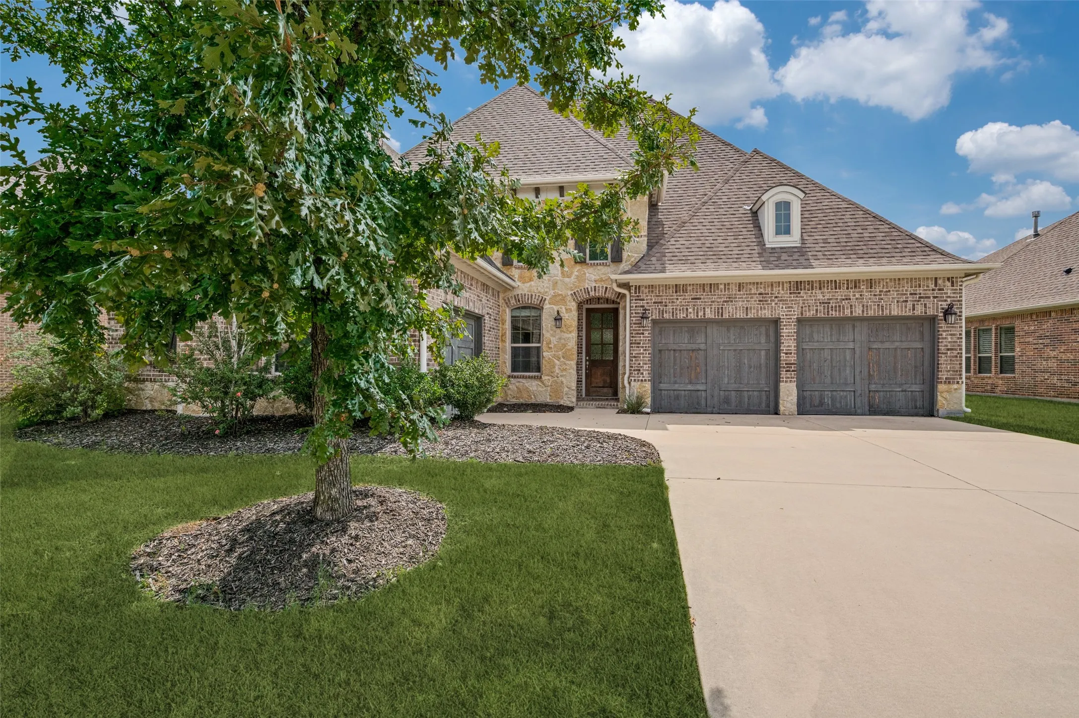 Beautiful front exterior showcasing the home's impressive architecture and well-maintained landscaping.