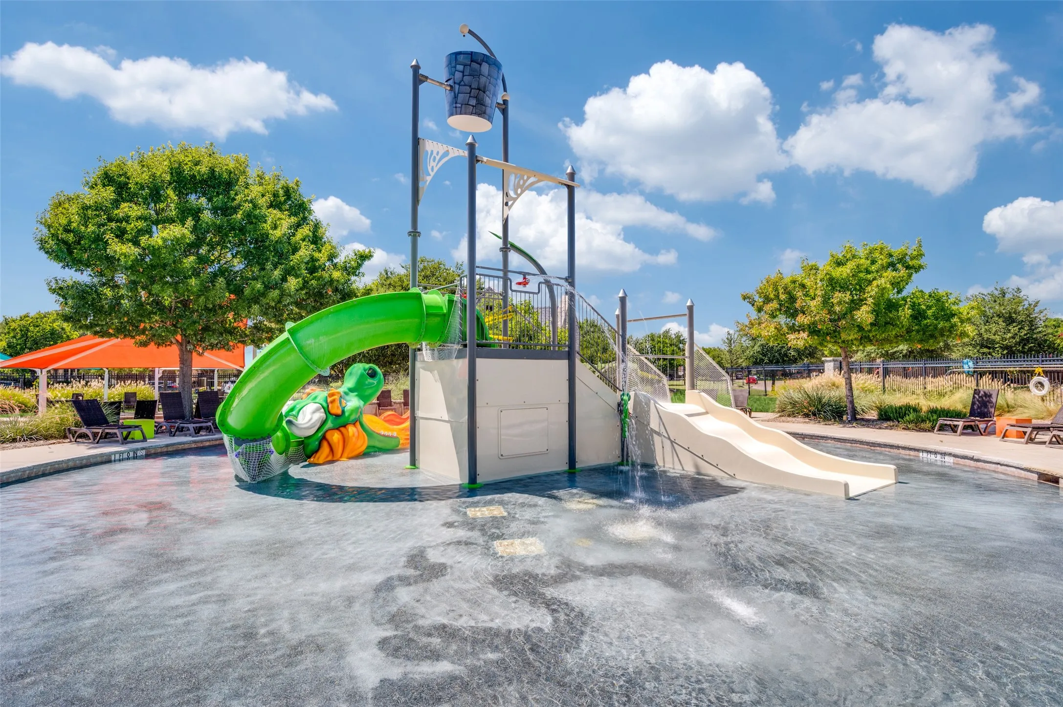 Community splash park featuring interactive water features and ample space for family fun.