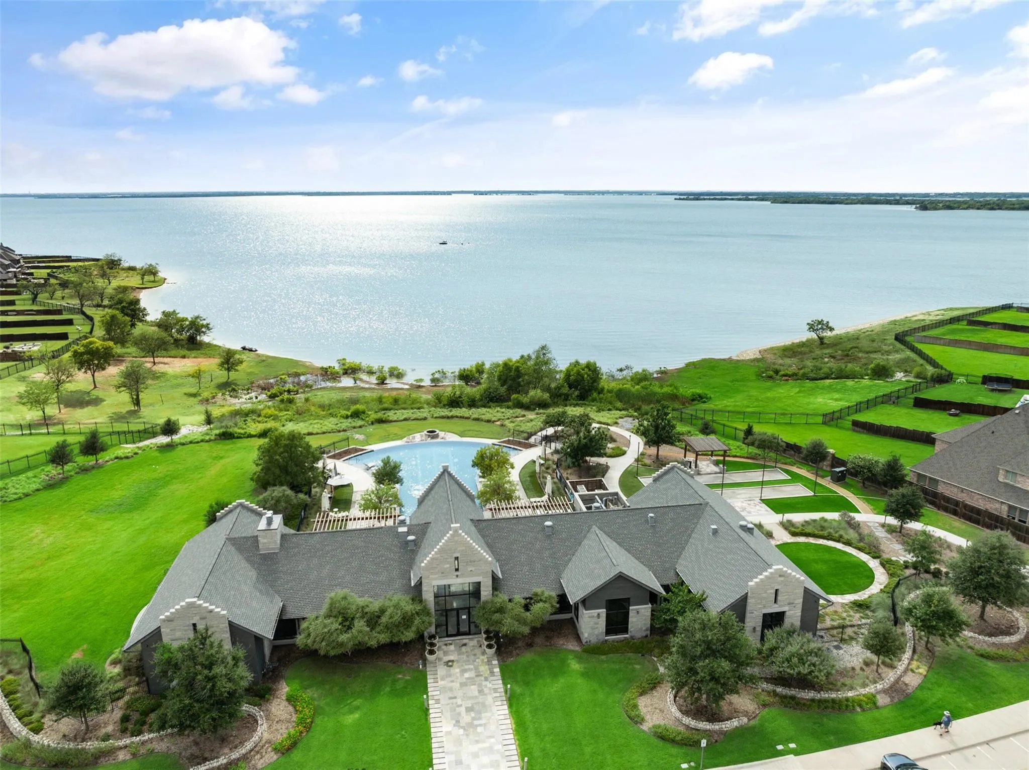 Aerial view of the award-winning Waterford amenity center showcasing resort-style living and picturesque lake views.