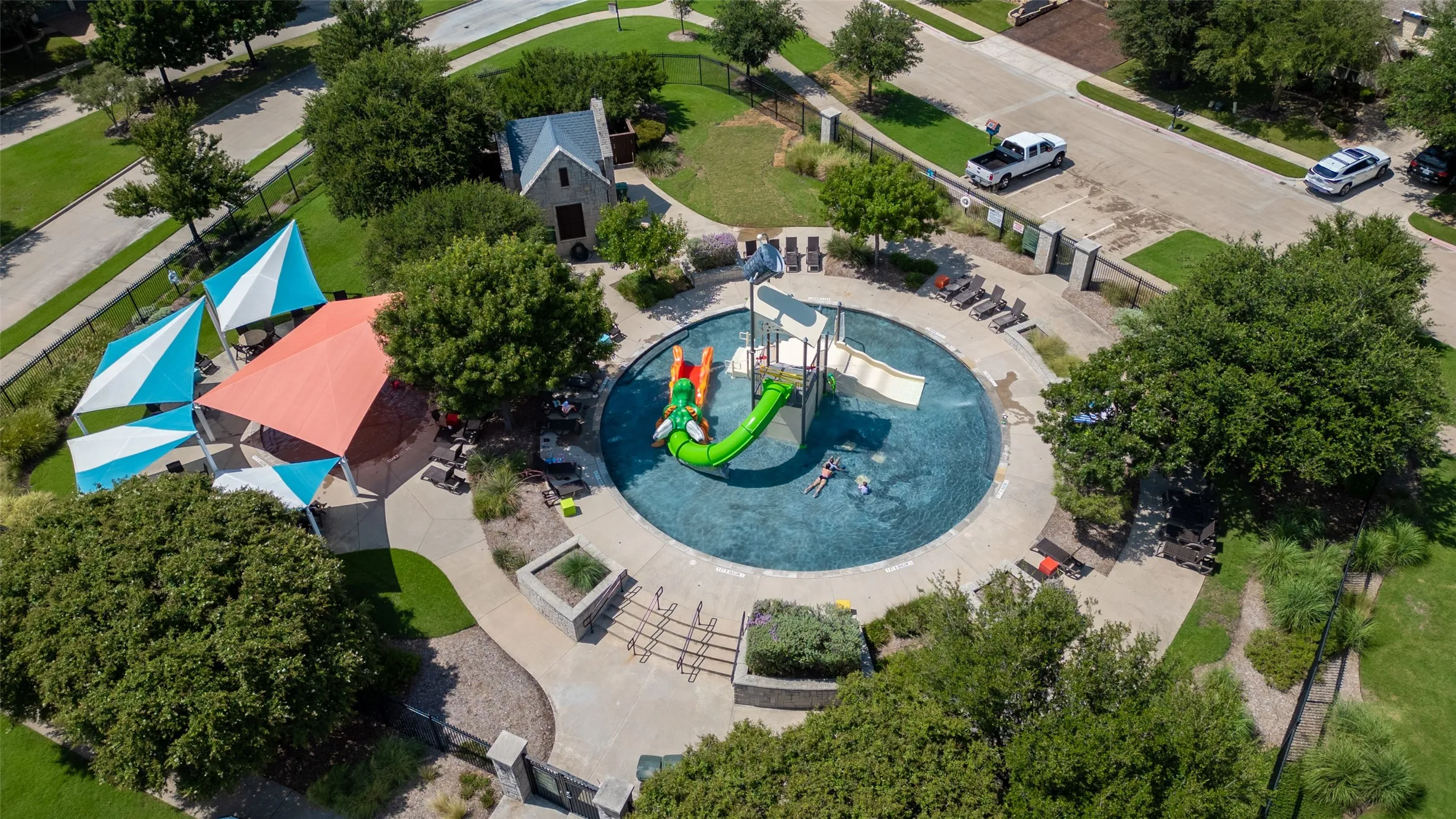 Aerial view of the neighborhood water park and recreational amenities available to residents.