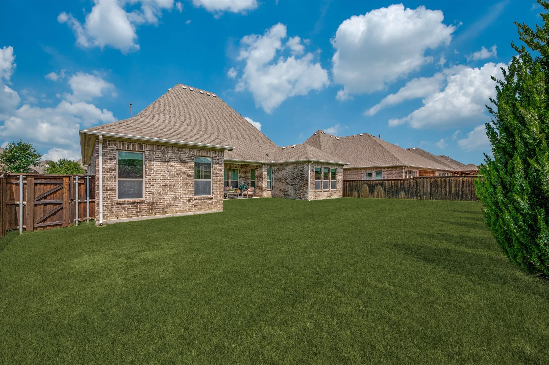 Large fenced backyard offering privacy, outdoor enjoyment, and endless possibilities for customization.