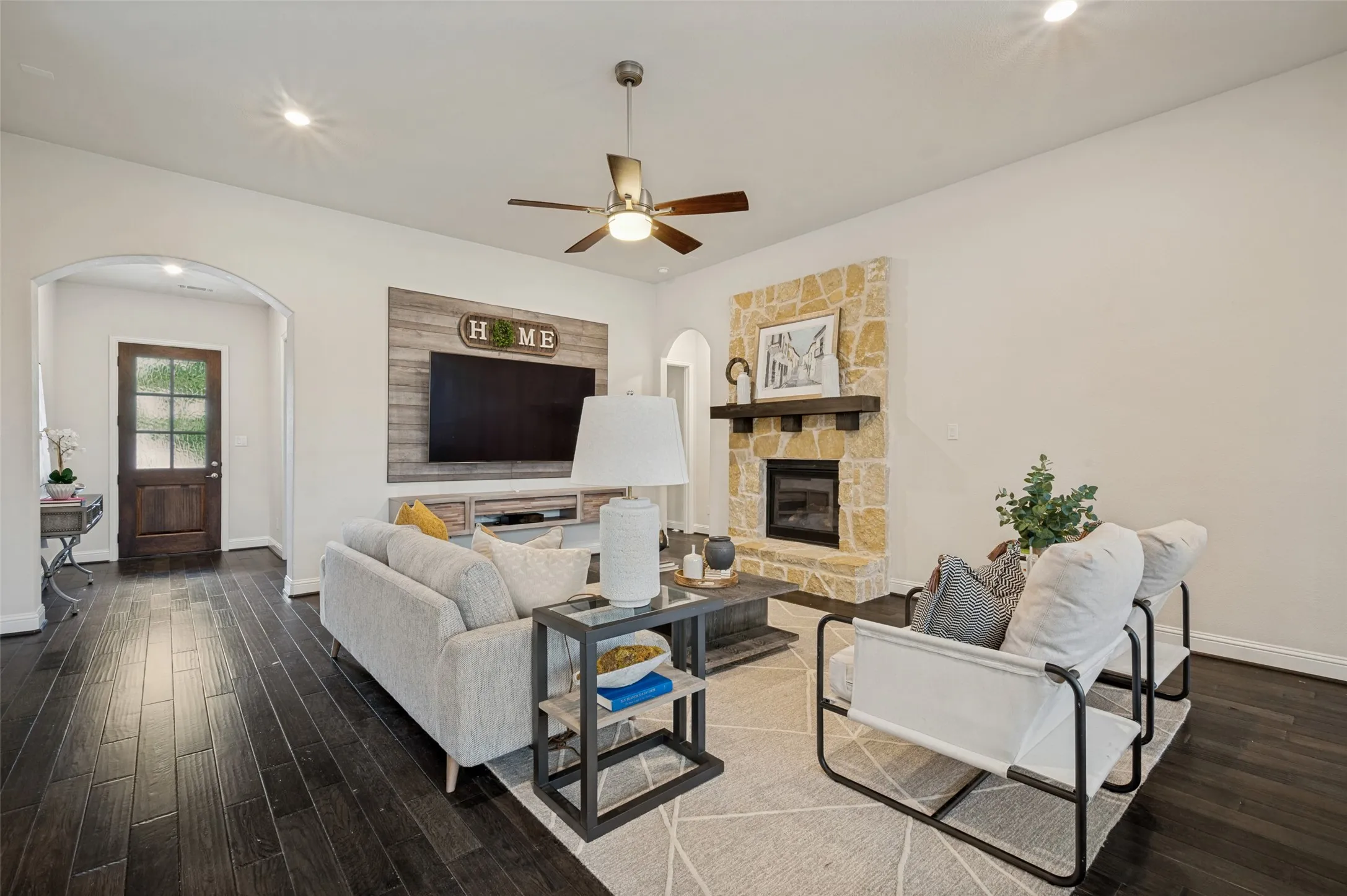 Open-concept living space seamlessly connecting the family room, dining area, and gourmet kitchen.
