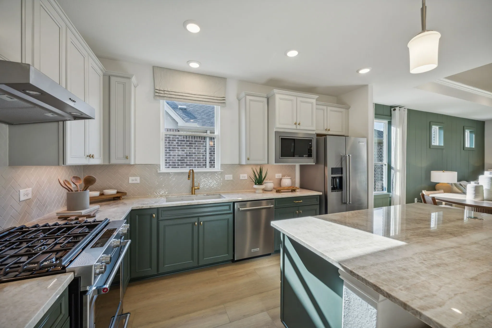 *Model Representation - Large island overlooking gathering room and dining areas