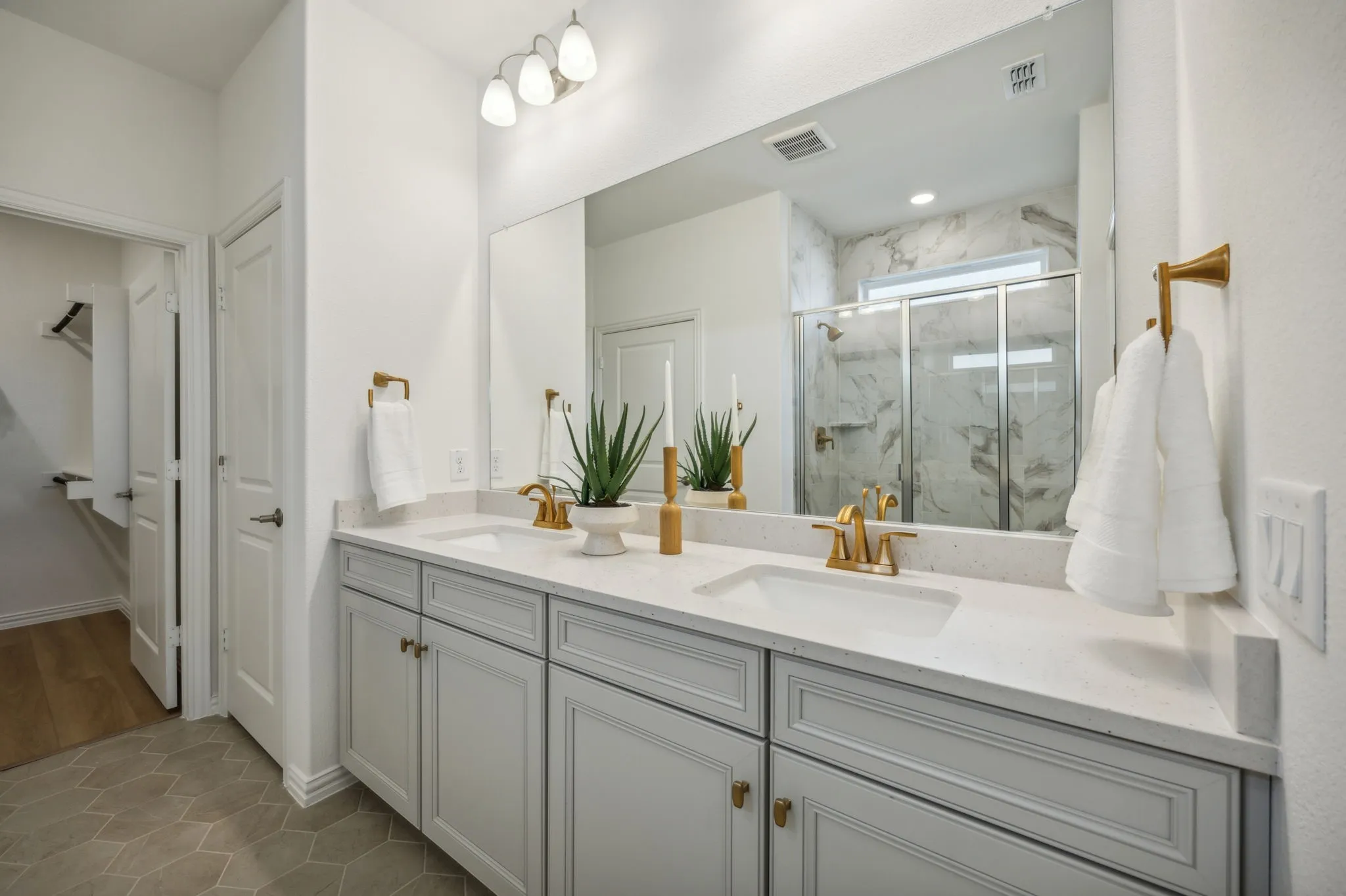 *Model Representation - Owner's private bath with double vanity