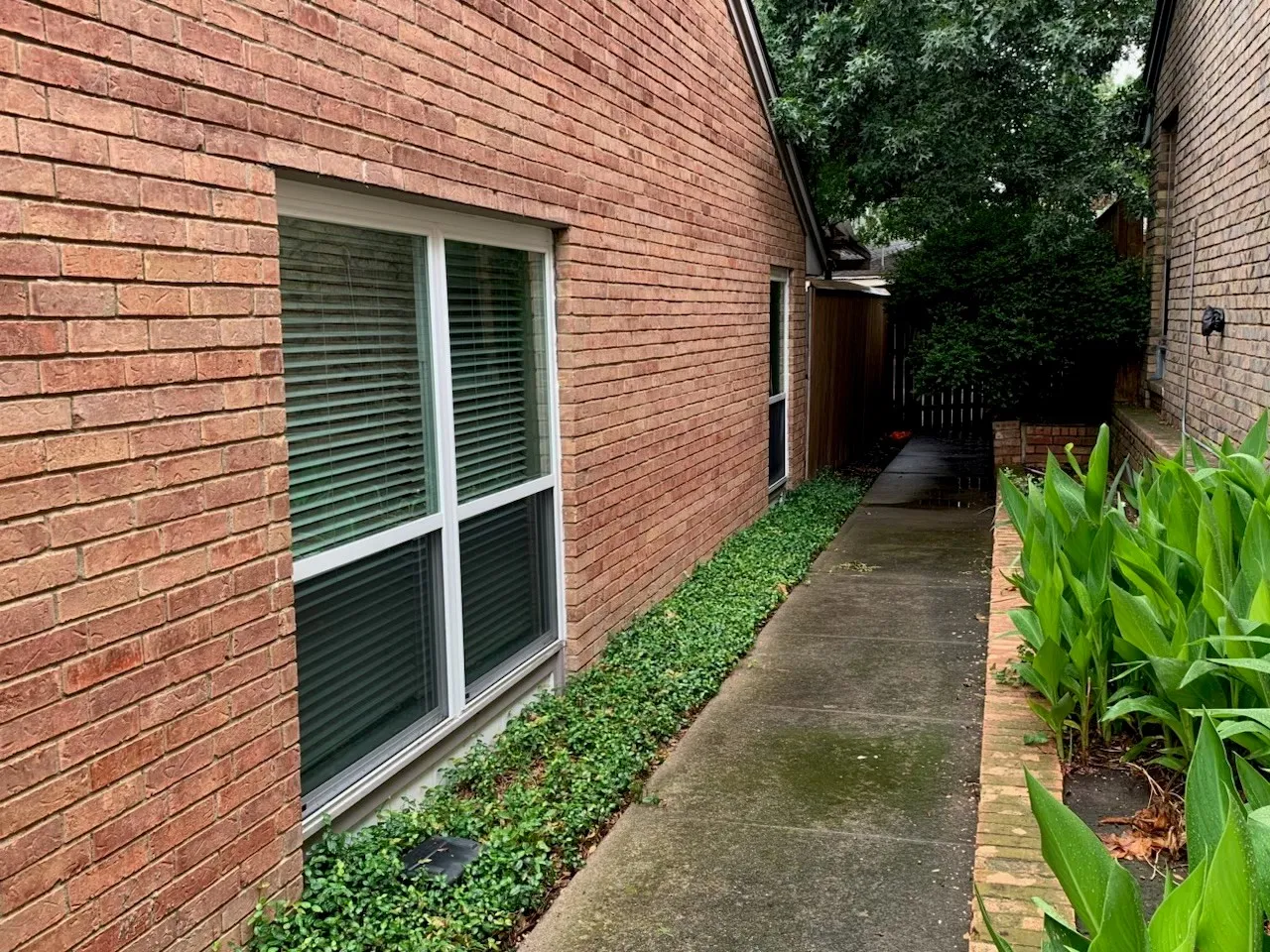 View of property exterior featuring brick siding