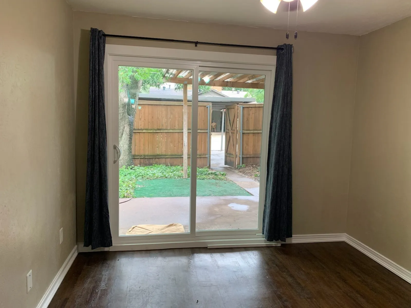 Doorway to outside with baseboards and wood finished floors