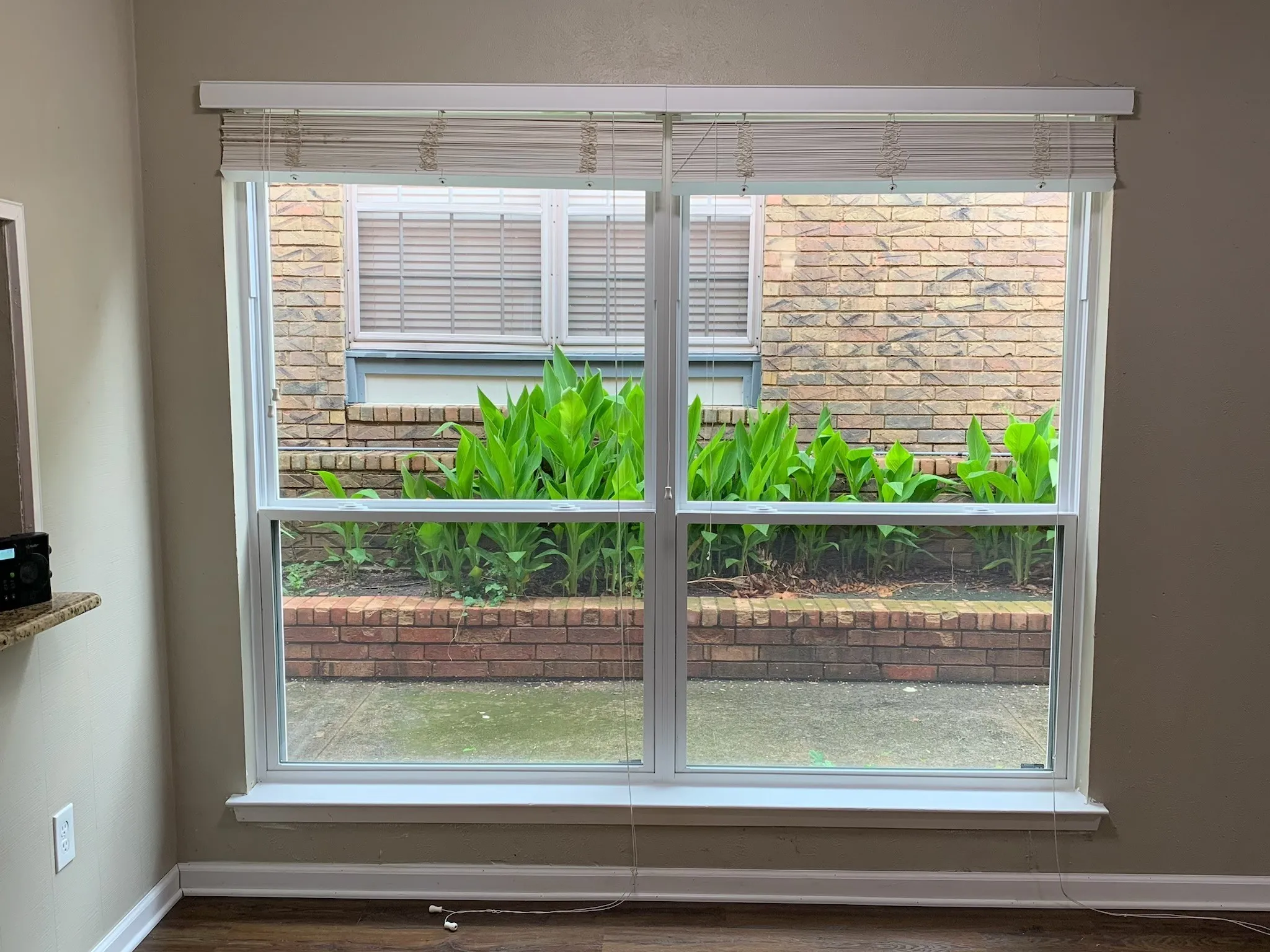Detailed view of baseboards and wood finished floors