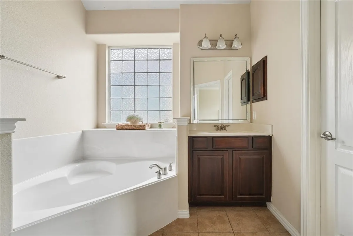 Soaking tub with a privacy glass window