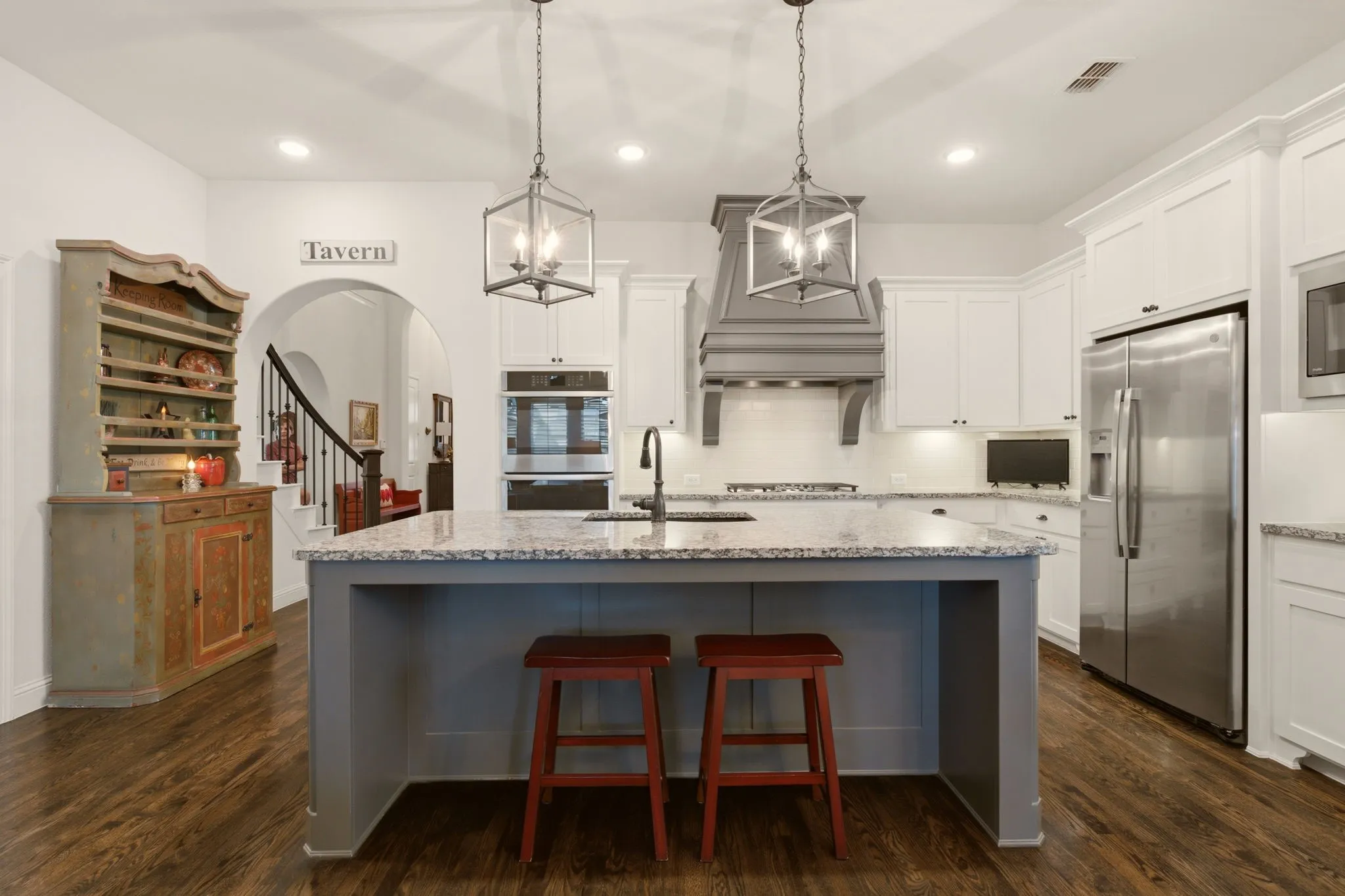 A classic, traditional kitchen designed for the family chef, featuring extensive cabinet storage, generous counter space, with a thoughtful layout that makes cooking & gathering effortless.