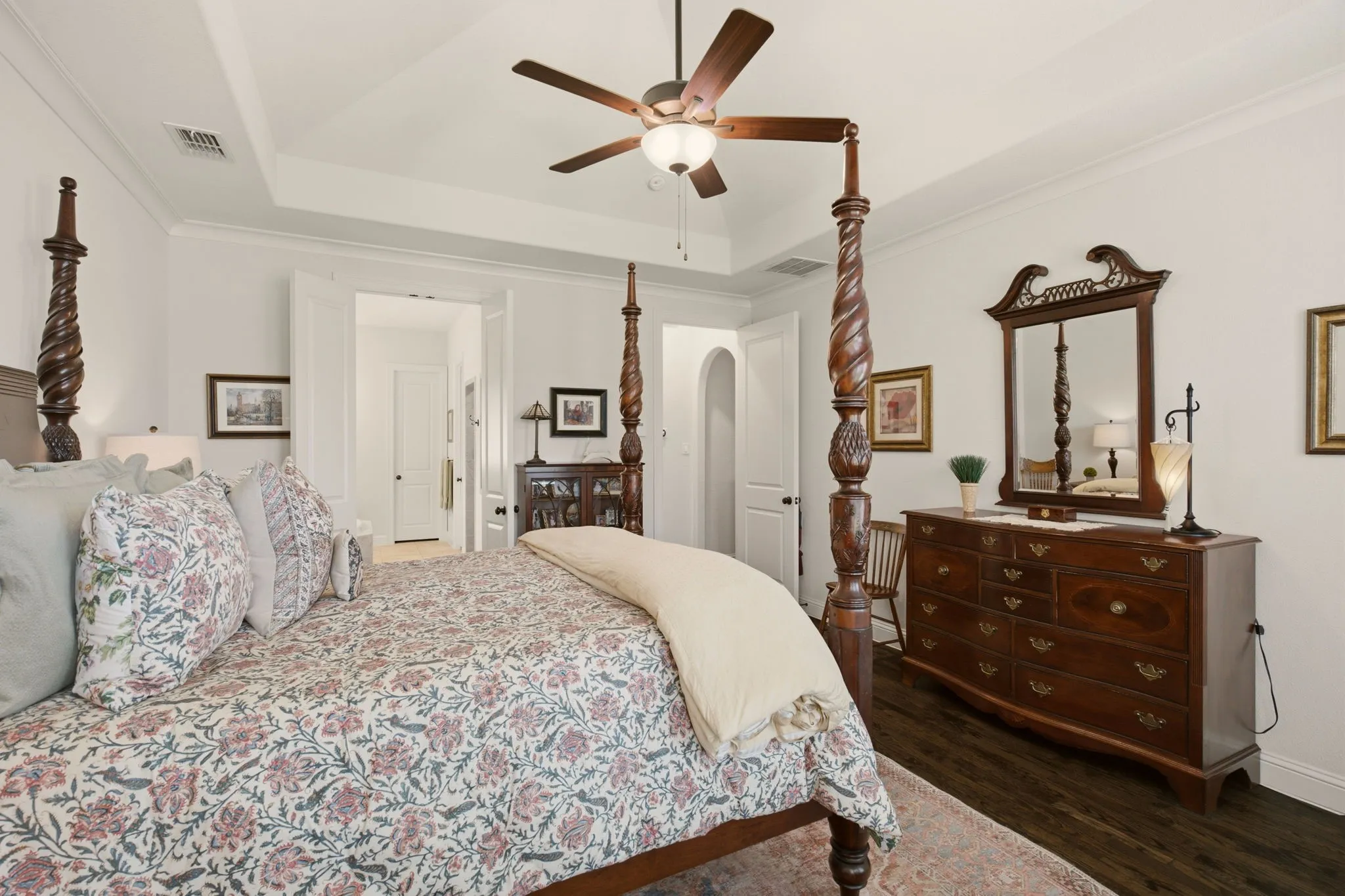 The primary bedroom includes a warm & inviting sitting area, giving it a timeless feel with plenty of room to unwind.