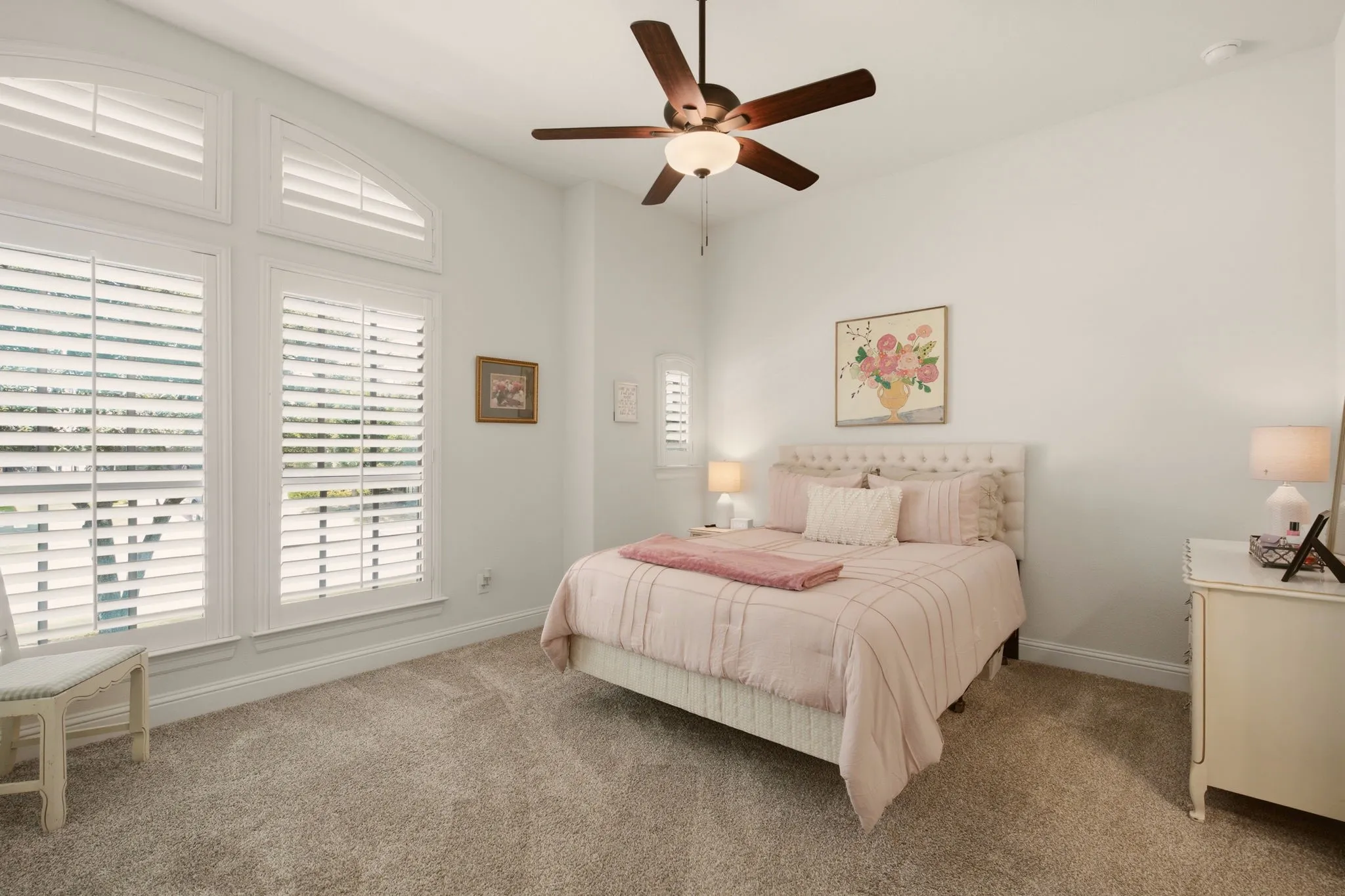 Large bedroom 2 faces the front of the home. Simple & pretty! All bedrooms have plush carpet & pads.
