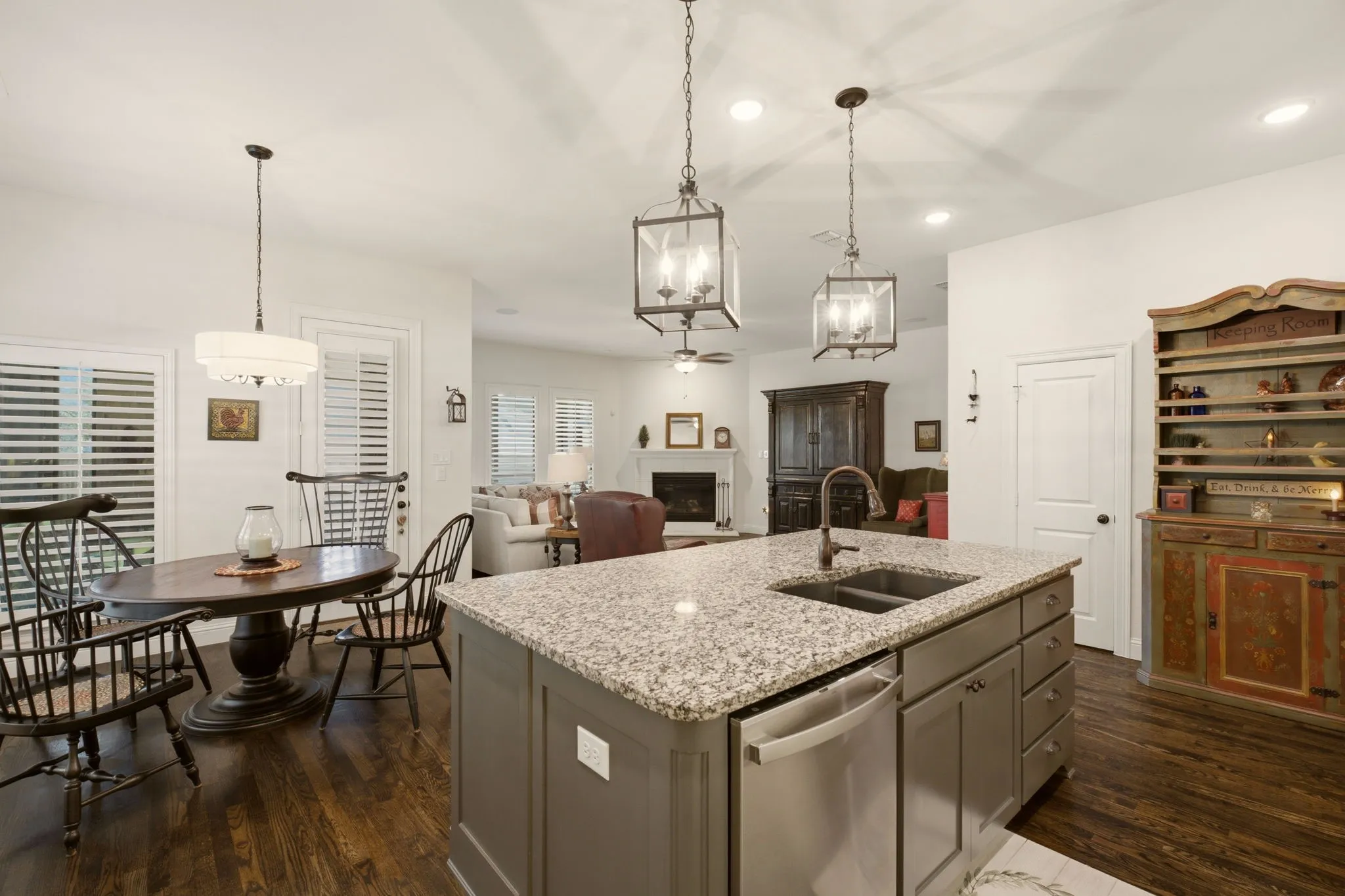 An entertaining floorplan, the open flow from the kitchen to the living room is perfect for intimate gatherings or celebrating holidays. Walk-in pantry through the right door.