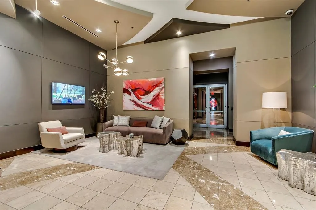 Lobby area featuring large format tile flooring with contrasting accent borders