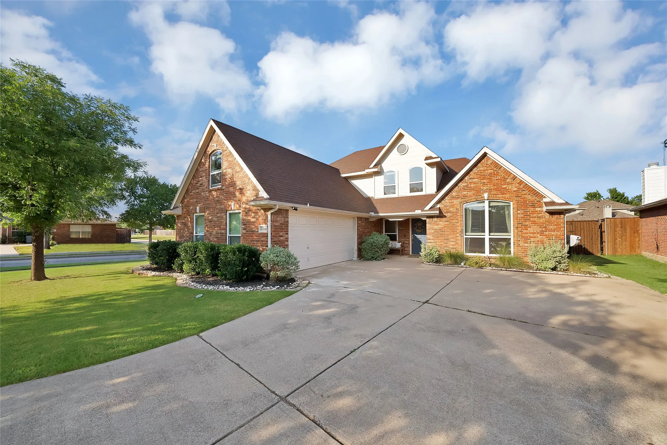 Brick and siding exterior with a two-car garage