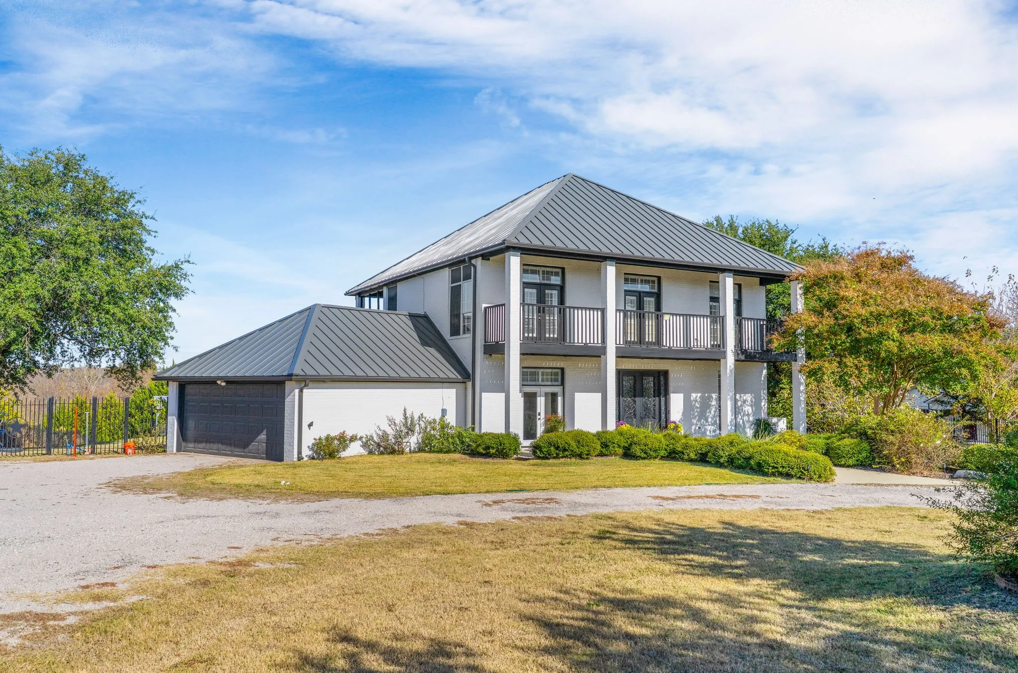 Private driveway leads to the attached two-car garage.