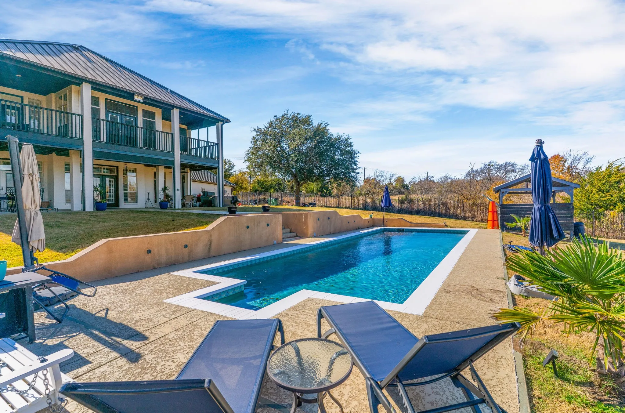  RESORT-STYLE LIVING on 1.2+ acres with a SPARKLING POOL and fully private backyard. Featuring a gas heater for year-round enjoyment!