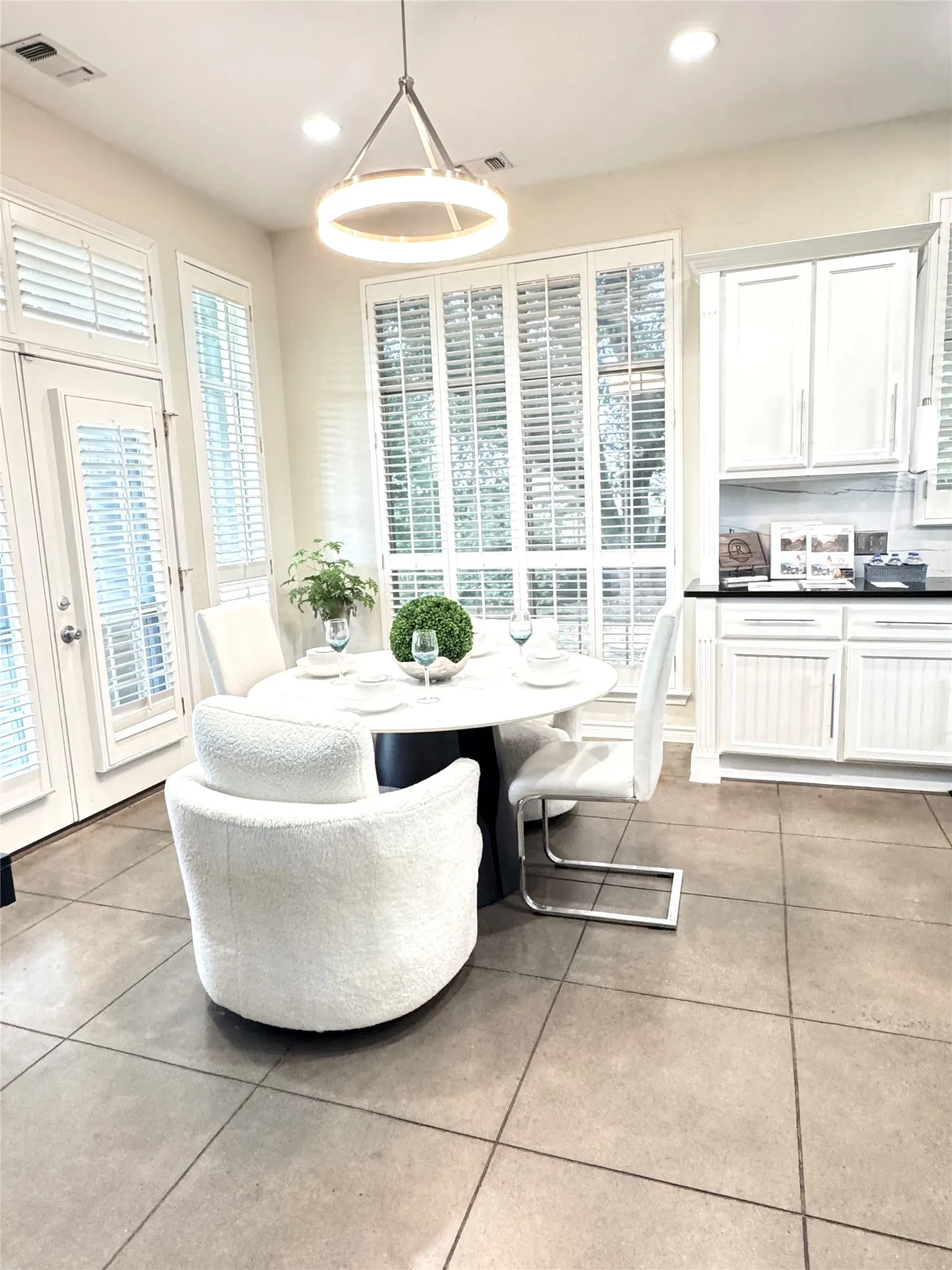 The dining area off the kitchen is the perfect place for enjoying meals and beautiful views.