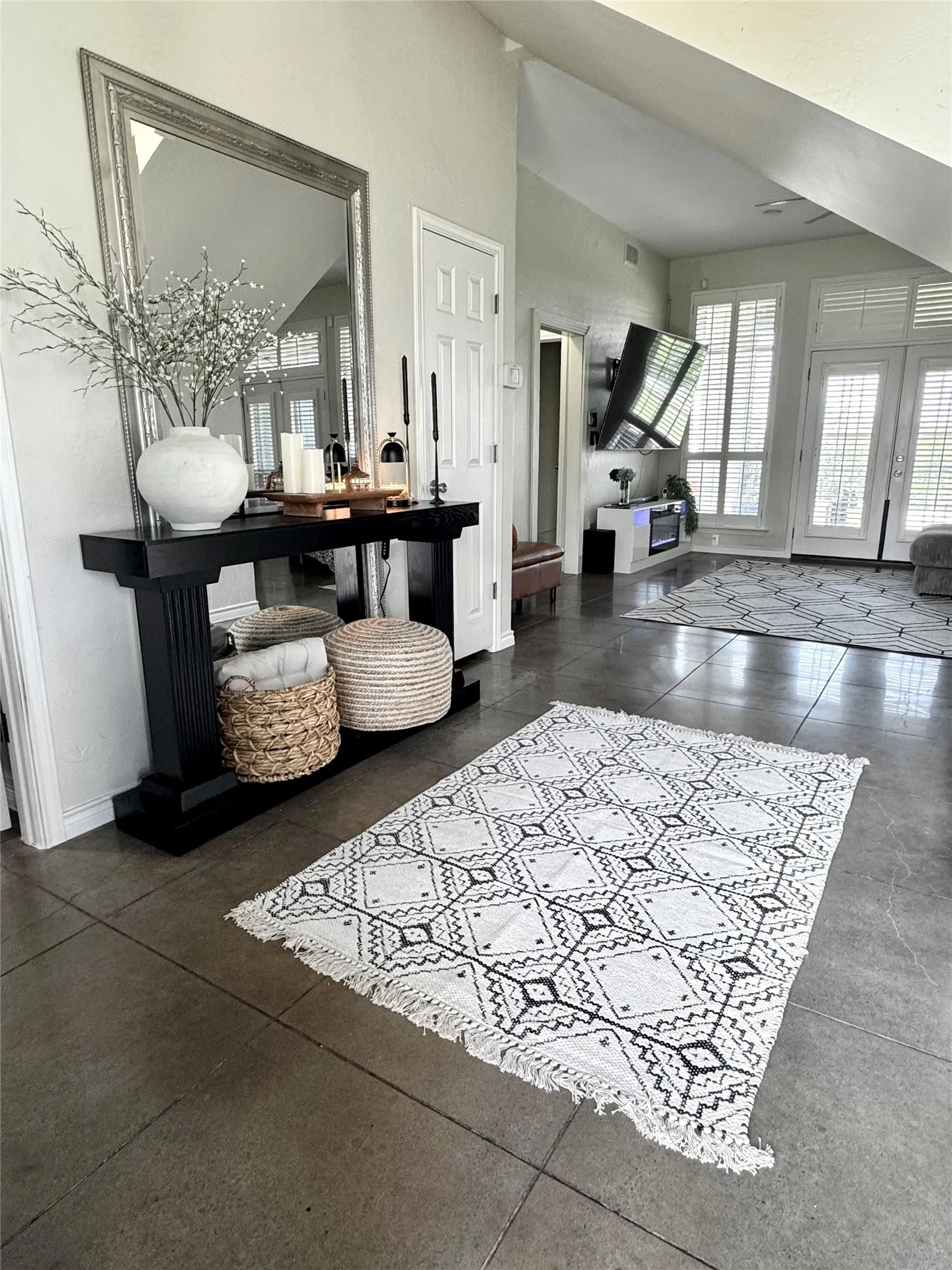The first floor boasts easy-maintenance, newly stained concrete floors.