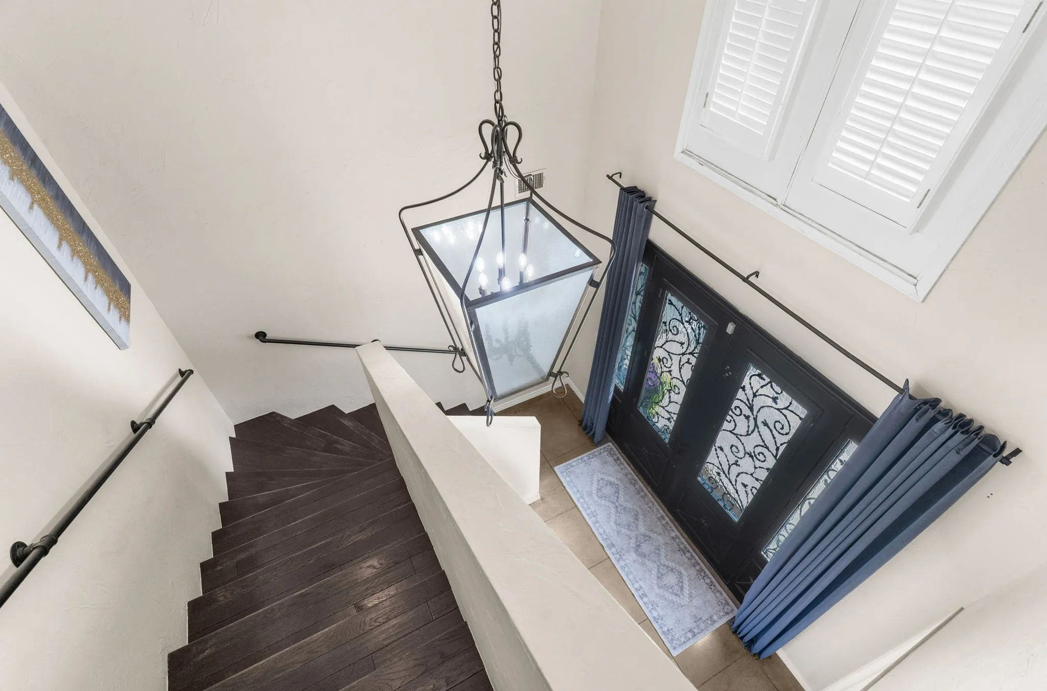 Updated, real wood stairs lead you up to the second floor.