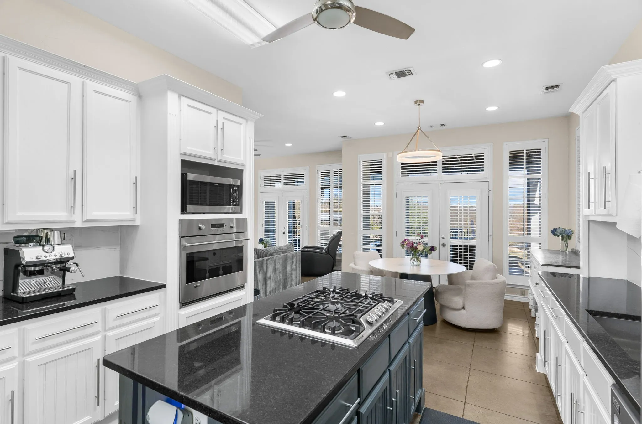 The kitchen features modern, stainless steel appliances and a gas cooktop!