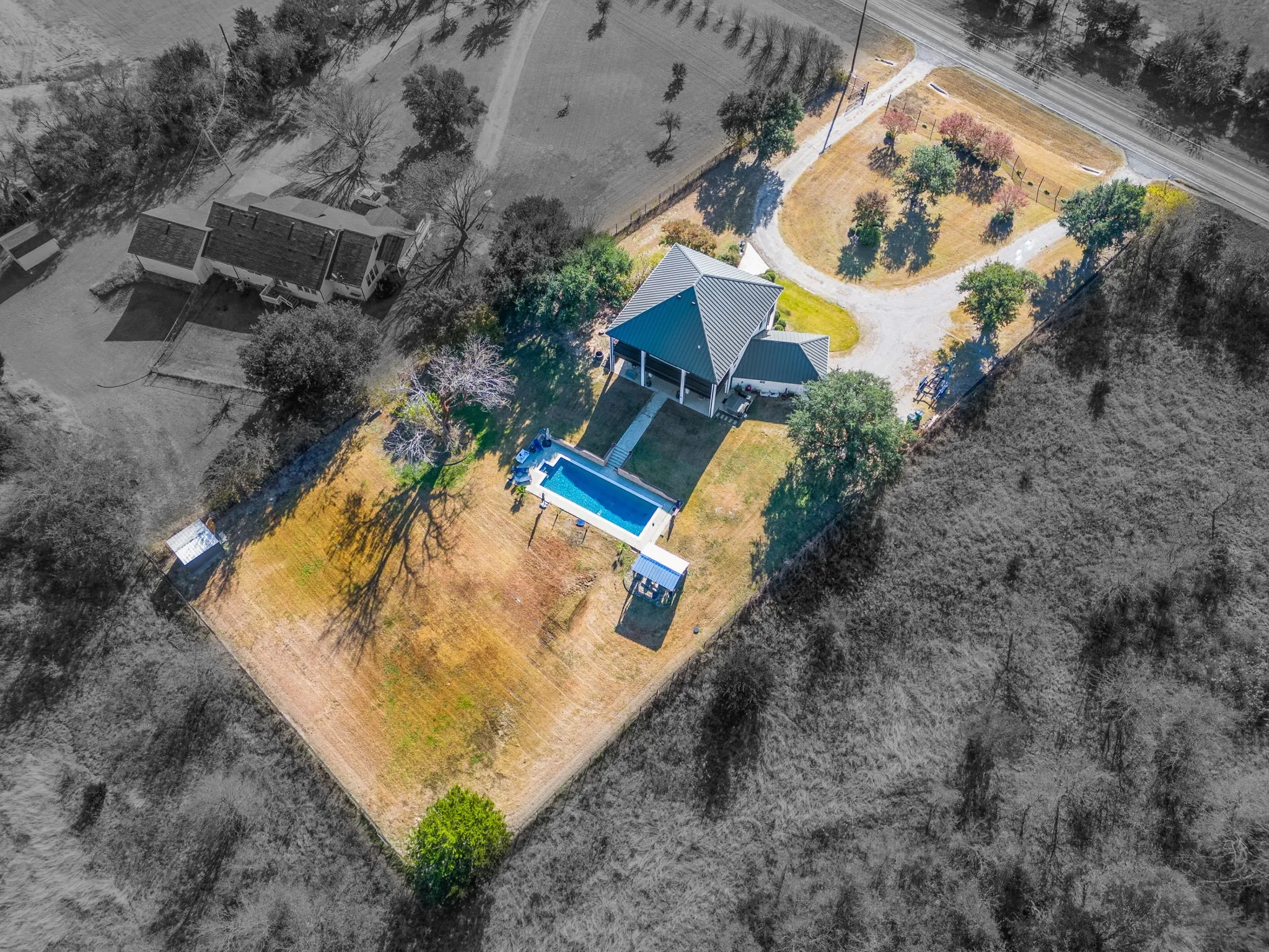 The property also features an outdoor storage wood with metal roof shed build in 2022.