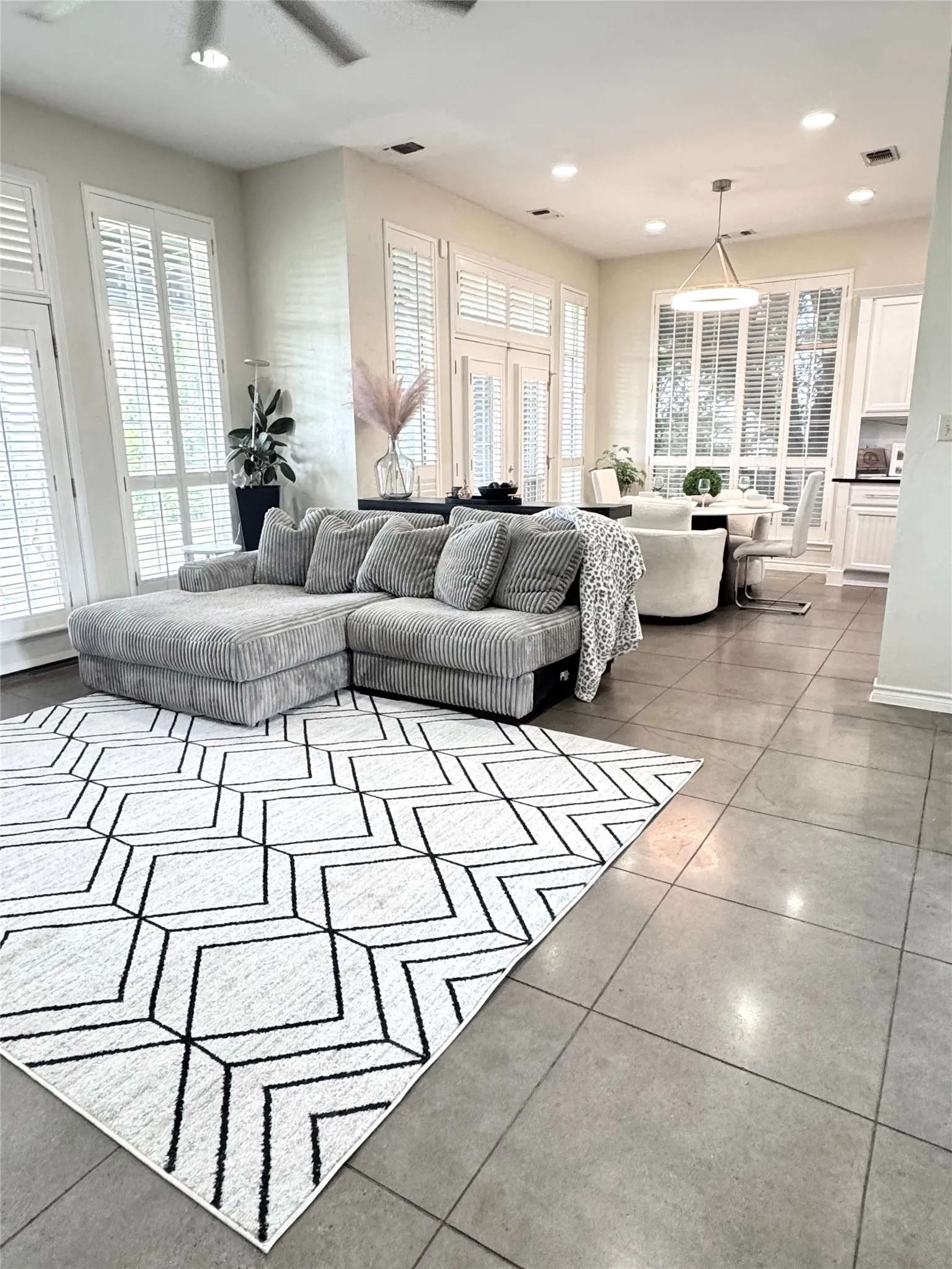 The open-concept living room flows effortlessly into the kitchen and dining area.