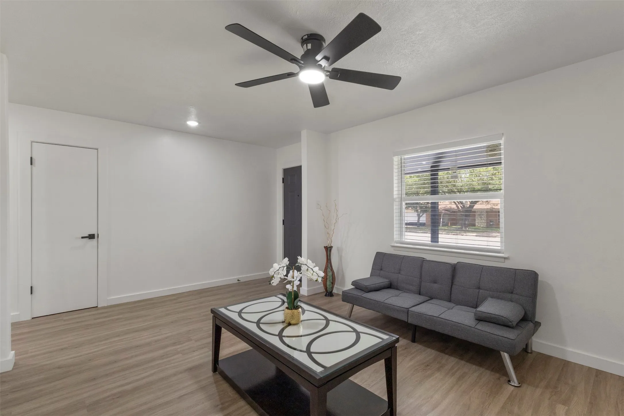 Living room with a coat closet