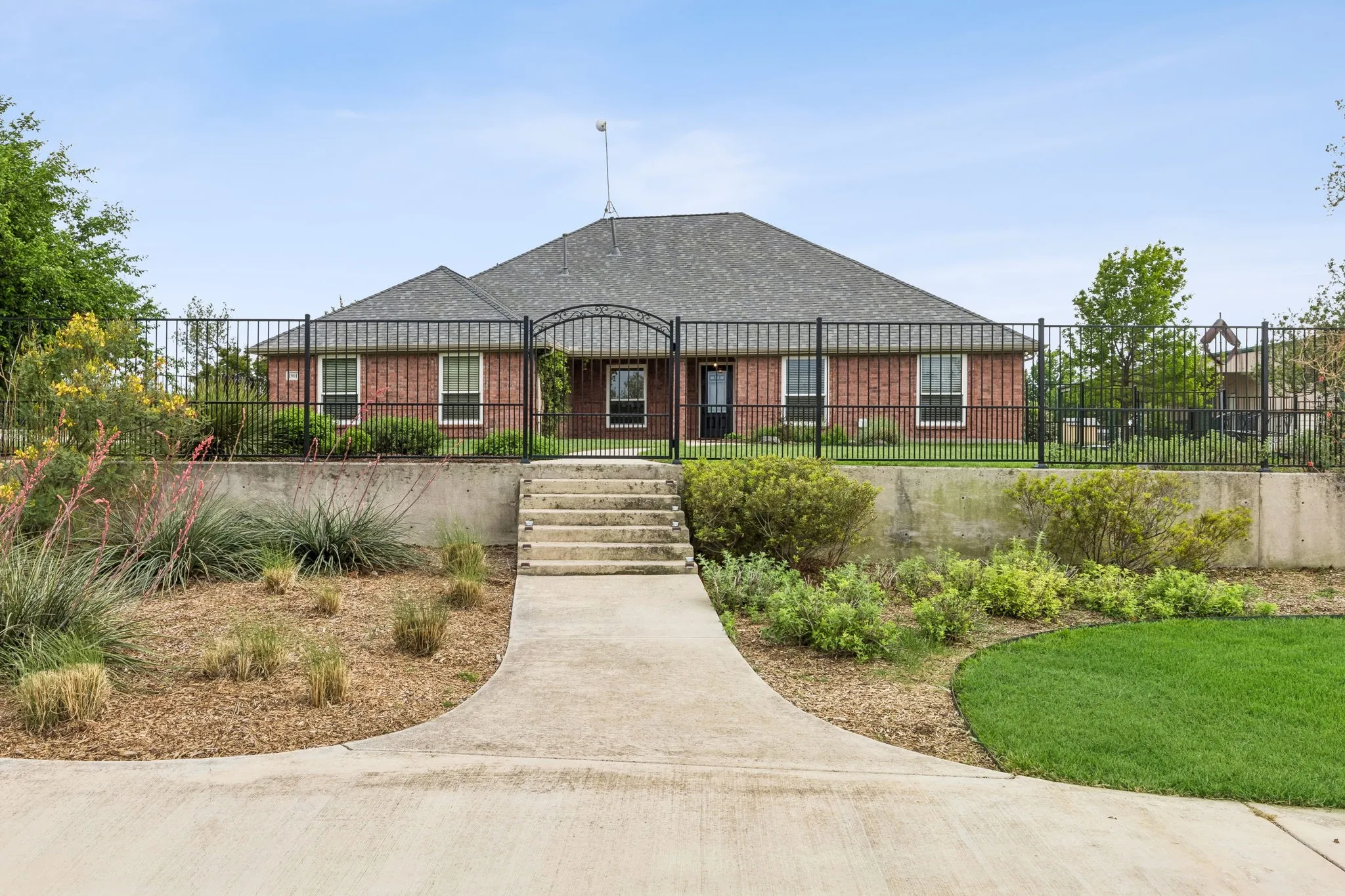 Beautiful Elevated Lot With Manicured Grounds And Wrought Iron Fence