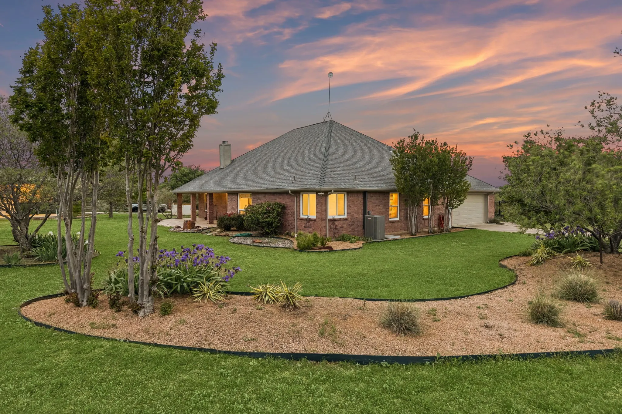 Lush Grounds With Gardens And Serene Sunset Views