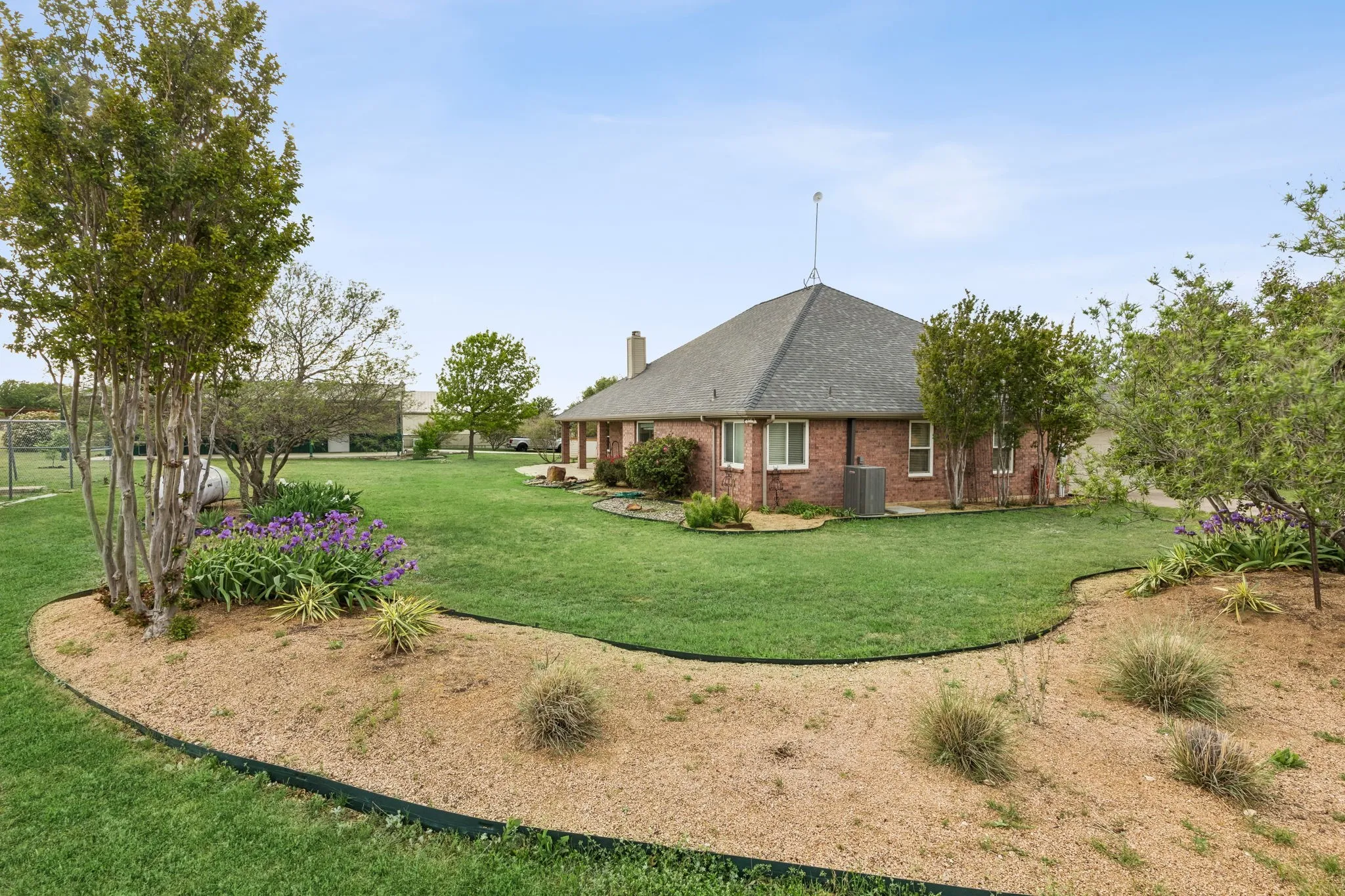 Lush Grounds With Gardens And Serene Sunset Views