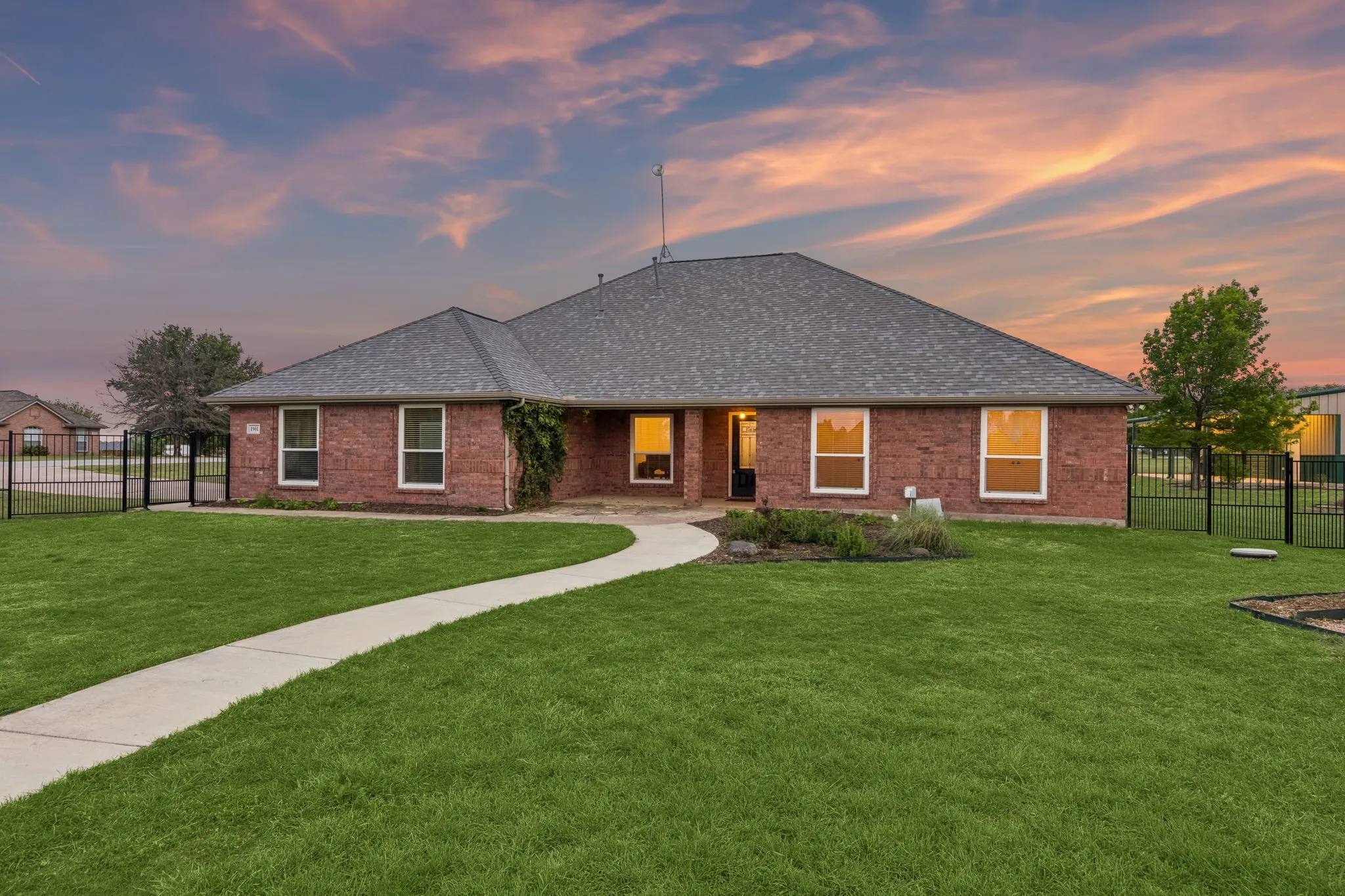 Beautiful Outdoor Setting With Green Space, Gardens, And Sunset Views