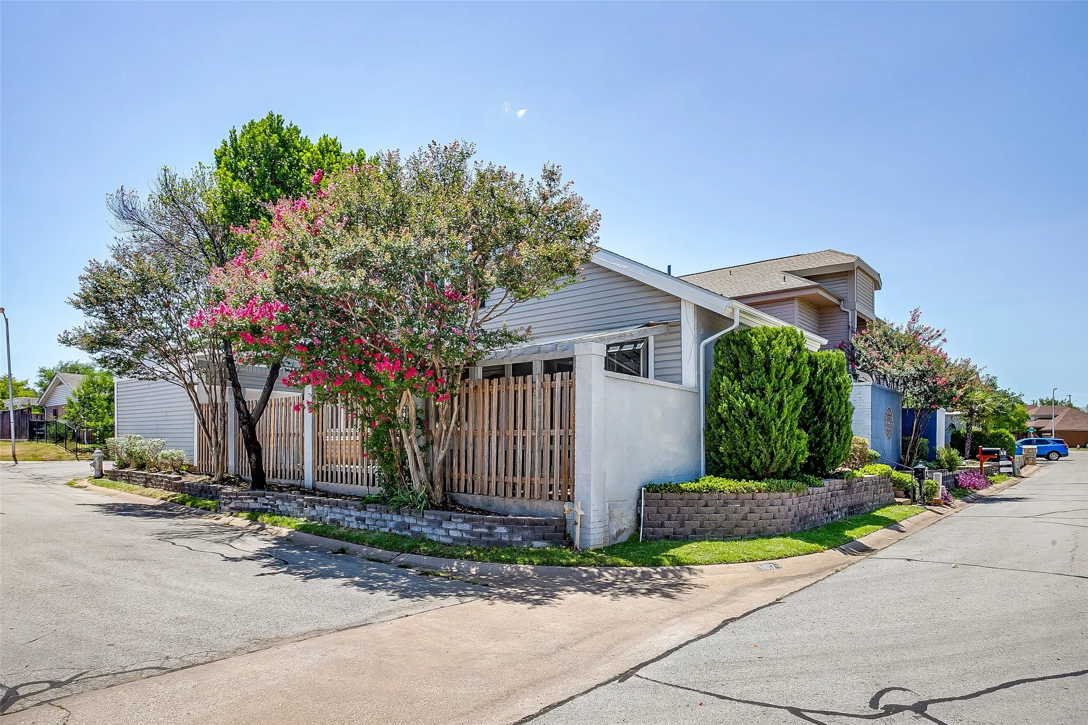 Fenced courtyard entry with low-maintenance landscaping.