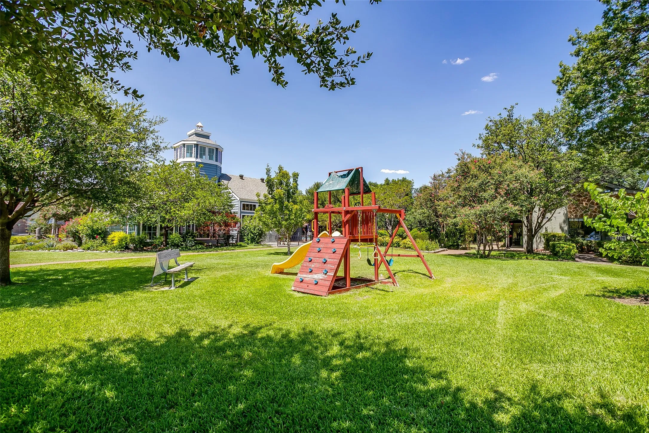 Community park and playground with waterfront green space.