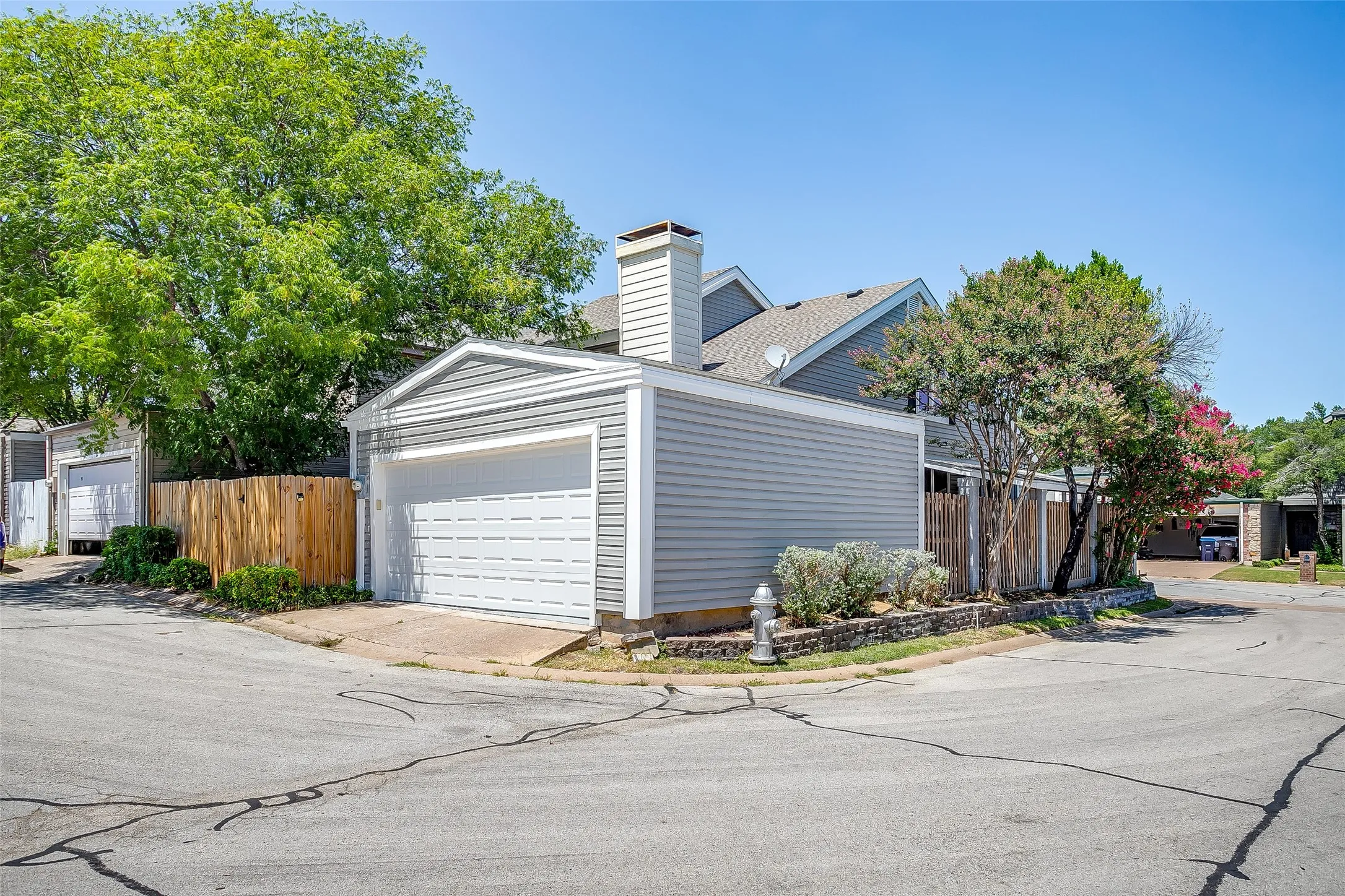 Detached two-car garage with rear street access.