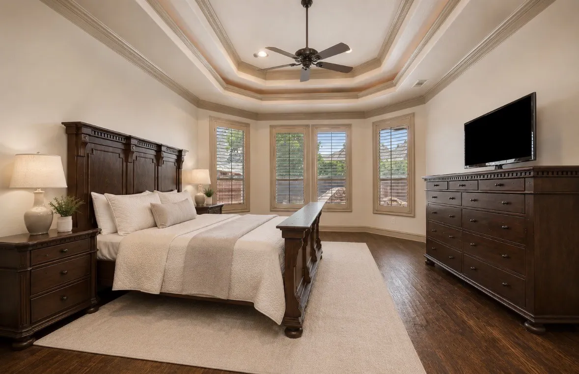Spacious Primary Bedroom with Bay Window Seating area and Lighted Tray Ceiling